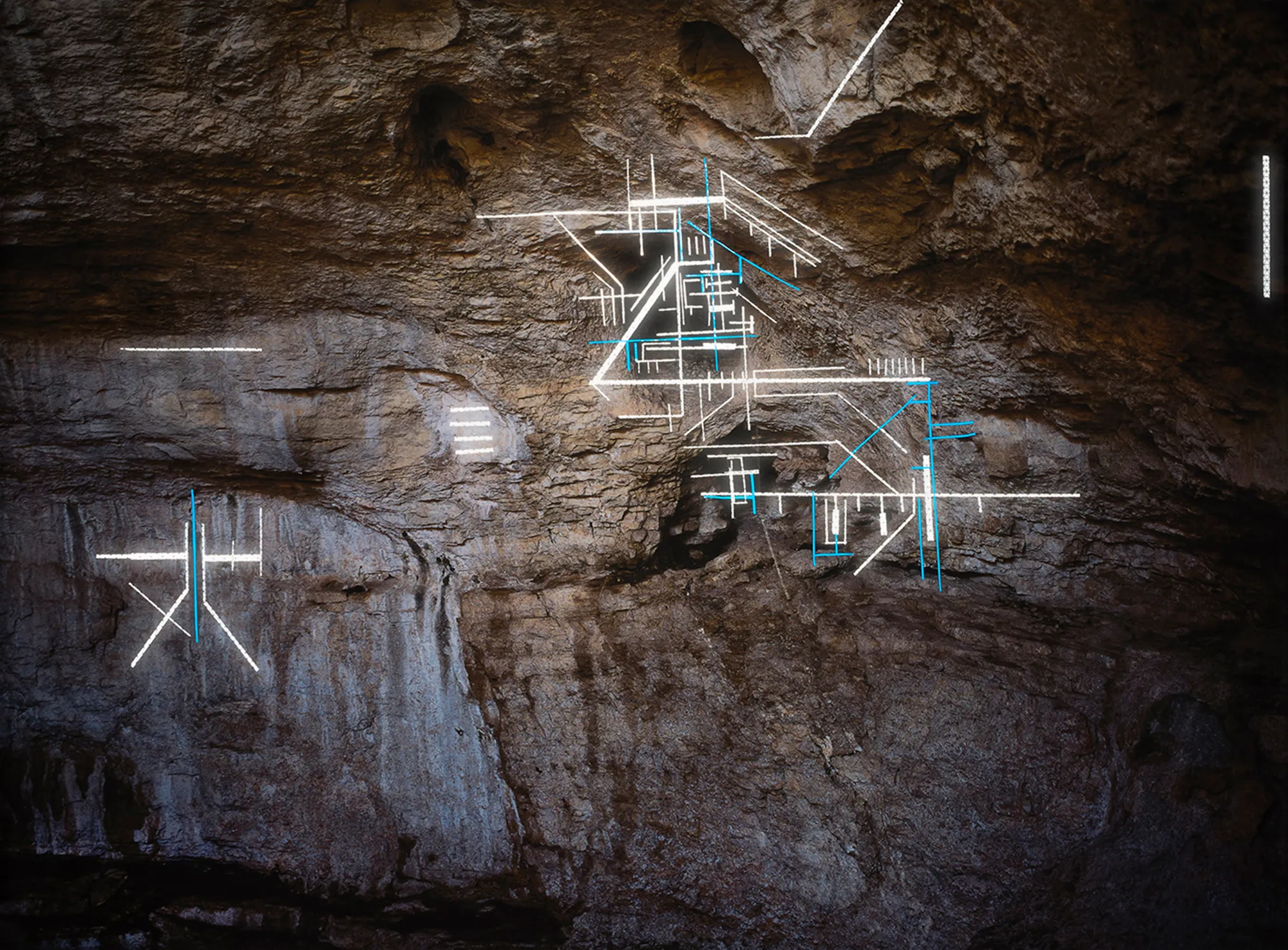 In this series I create geometric gestures in the landscape reminiscent of cave paintings to illustrate the complex relationship between language and abstraction blurring subjective interpretation and communal understanding. Caves and landscapes are uncivilized spaces free from cultural baggage, places that need no language, sites for the viewer to interpret freely, devoid of iconographic logic. The reflective safety tape that creates these shapes references my larger practice dealing with immigrant labor and construction work often performed by Latin American immigrants in the US. In English double negatives cancel one another and produce an affirmative, but in Spanish, they intensify the negation. Negative Concord conveys the struggle to meaningfully translate our human experience across languages and cultures. Now as part of the blockchain, these photographic NFTs become metaphors for this new, virtual landscape that is simultaneously being created, explored, and interpreted.