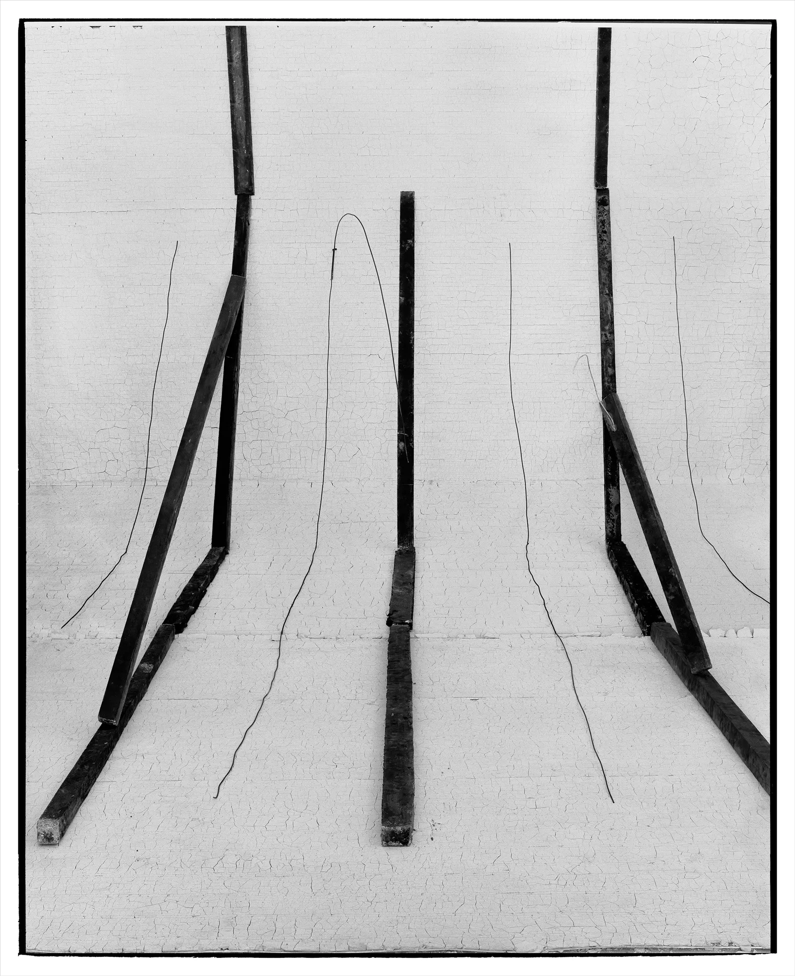 *Constructions* is my first NFT project, weaving together two of my most significant photographic series—*American Type* and *Hedonic Reversal*—as a unique set of 28 images. These architectural constructions, which I make in my studio and then photograph, reference forces of urban construction, destruction, and decay. Devoid of the depictions of labor from which these works were created and of which the work is inherently about, I also critique the ambiguity of post-war American abstraction and art world elitism. These works reference autobiographical threads in order to point to the larger sociopolitical backdrop upon which issues of migration and labor play out.