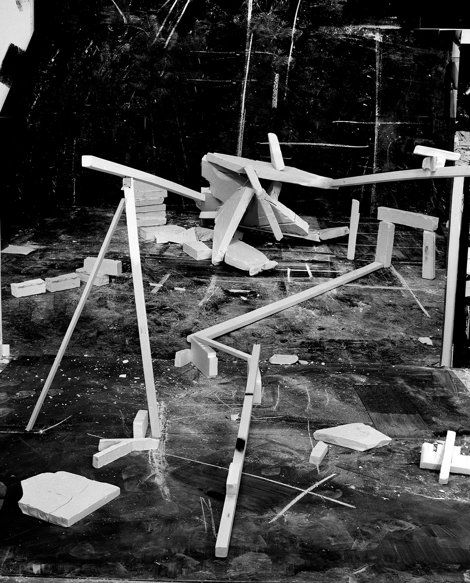 *Constructions* is my first NFT project, weaving together two of my most significant photographic series—*American Type* and *Hedonic Reversal*—as a unique set of 28 images. These architectural constructions, which I make in my studio and then photograph, reference forces of urban construction, destruction, and decay. Devoid of the depictions of labor from which these works were created and of which the work is inherently about, I also critique the ambiguity of post-war American abstraction and art world elitism. These works reference autobiographical threads in order to point to the larger sociopolitical backdrop upon which issues of migration and labor play out.