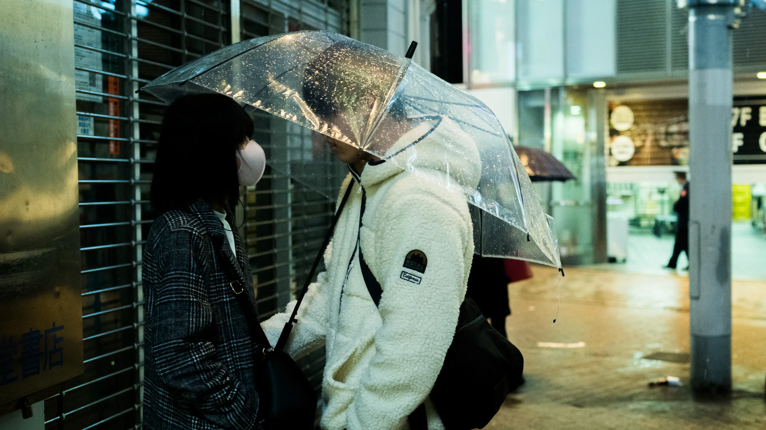 And they were there. 
Standing in front of each other, lost in a sea of emotions. 
Suddenly raindrops began to fall, he pulled out the umbrella, and slowly wrapped his arm around her waist, it felt like the world was only made for him, her, and love under the rain.

By: Ilan Derech
📸 Leica SL | ZEISS ZM 1.4/35
📍 Shibuya Toyko 2021
🖼 https://www.dreamingtokyo.com
Shot during the COVID-19 pandemic lockdown.