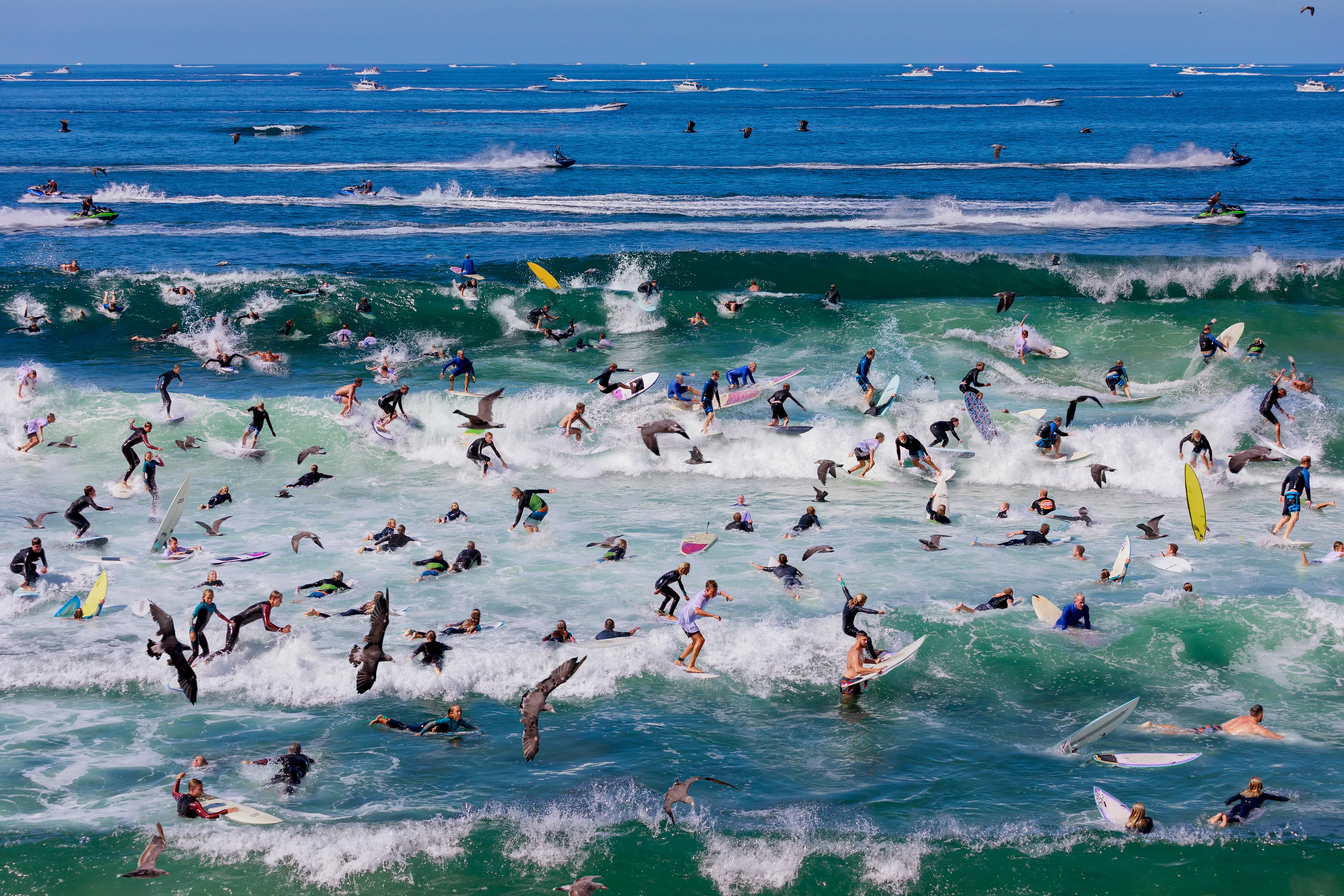 Each image is a kind of a still time-lapse photo that compresses a couple of hours and thousands of exposures of a sporting event into a single image that conveys a sense of play, the eeriness of time, and a feeling of Dionysian chaos.