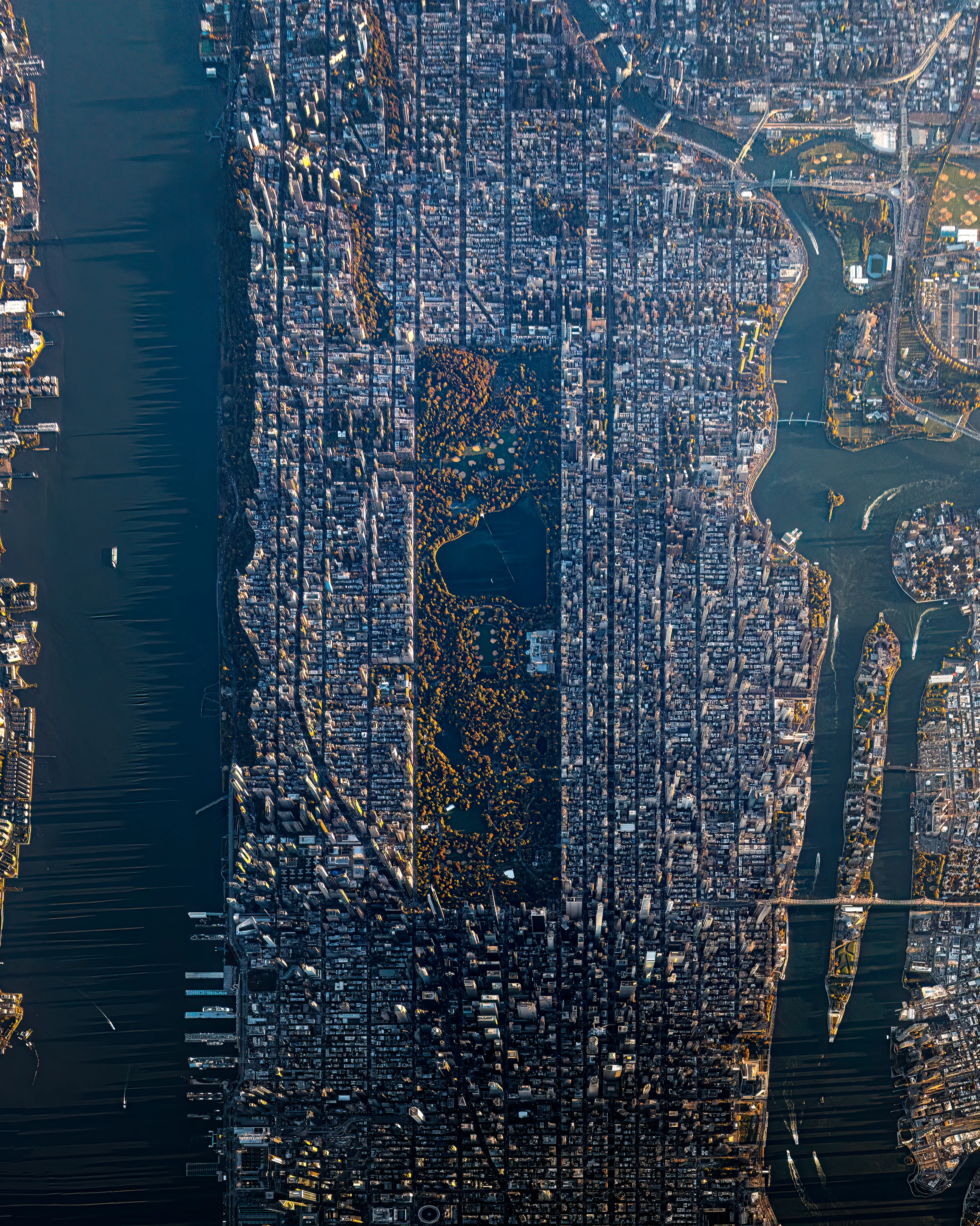 3 miles above NYC in an open-door helicopter has never been done before. So the images that came from this flight are all new to me as well as new to viewer.  This level of awe and wonder is a precious thing for a creator, and I hope that it translates in the imagery.  Here is a north (top of frame) to south view of the island of Manhattan and surrounding environs.  The avenues are pronounced in this orientation, as well as the shadows of the skyline on the Hudson River.  The first of 2 editions in the Sky Scraper series.  