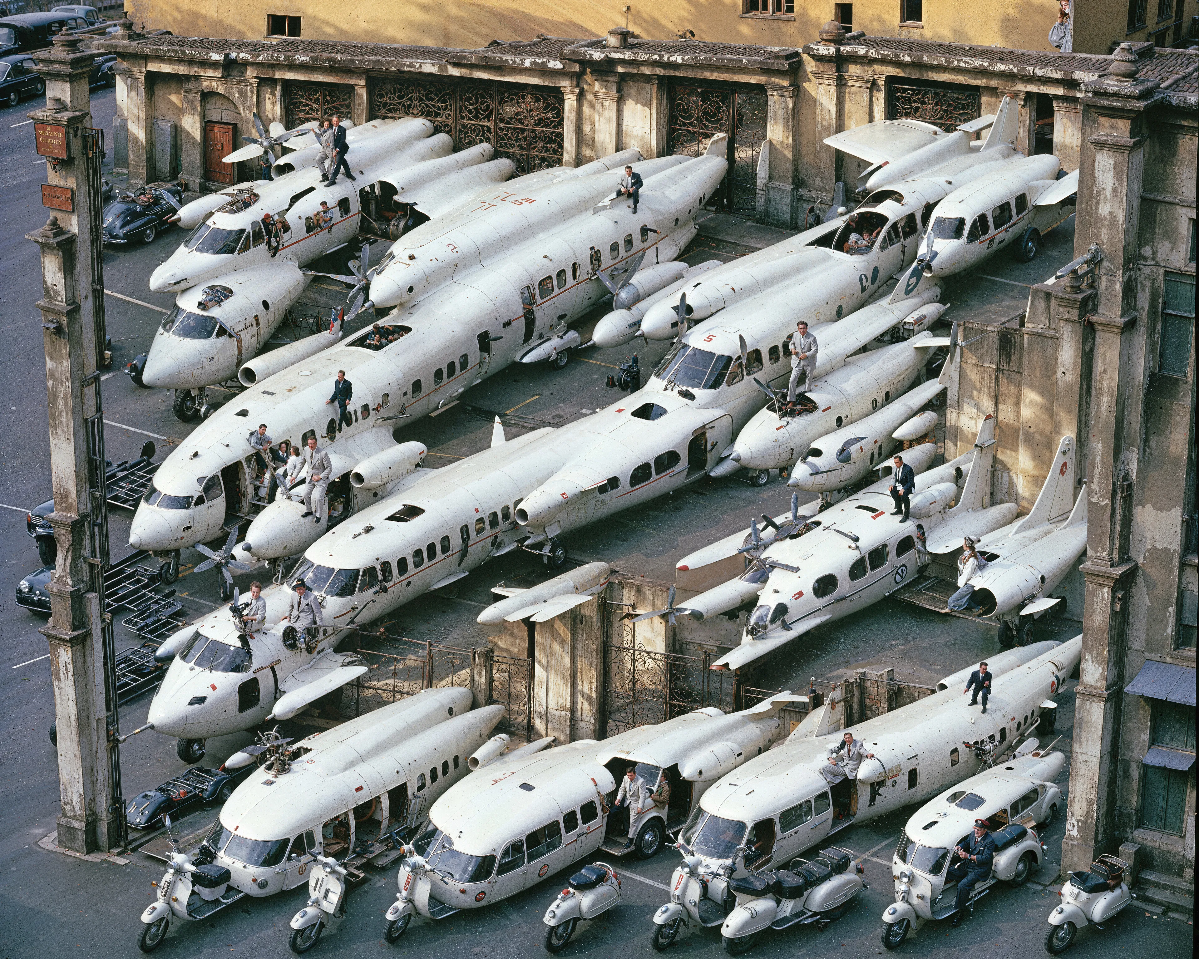35mm #1: England, London Airport, Unknown - A jet plane factory filled with unpainted fuselages on the assembly line
35mm #2: Date and location unknown