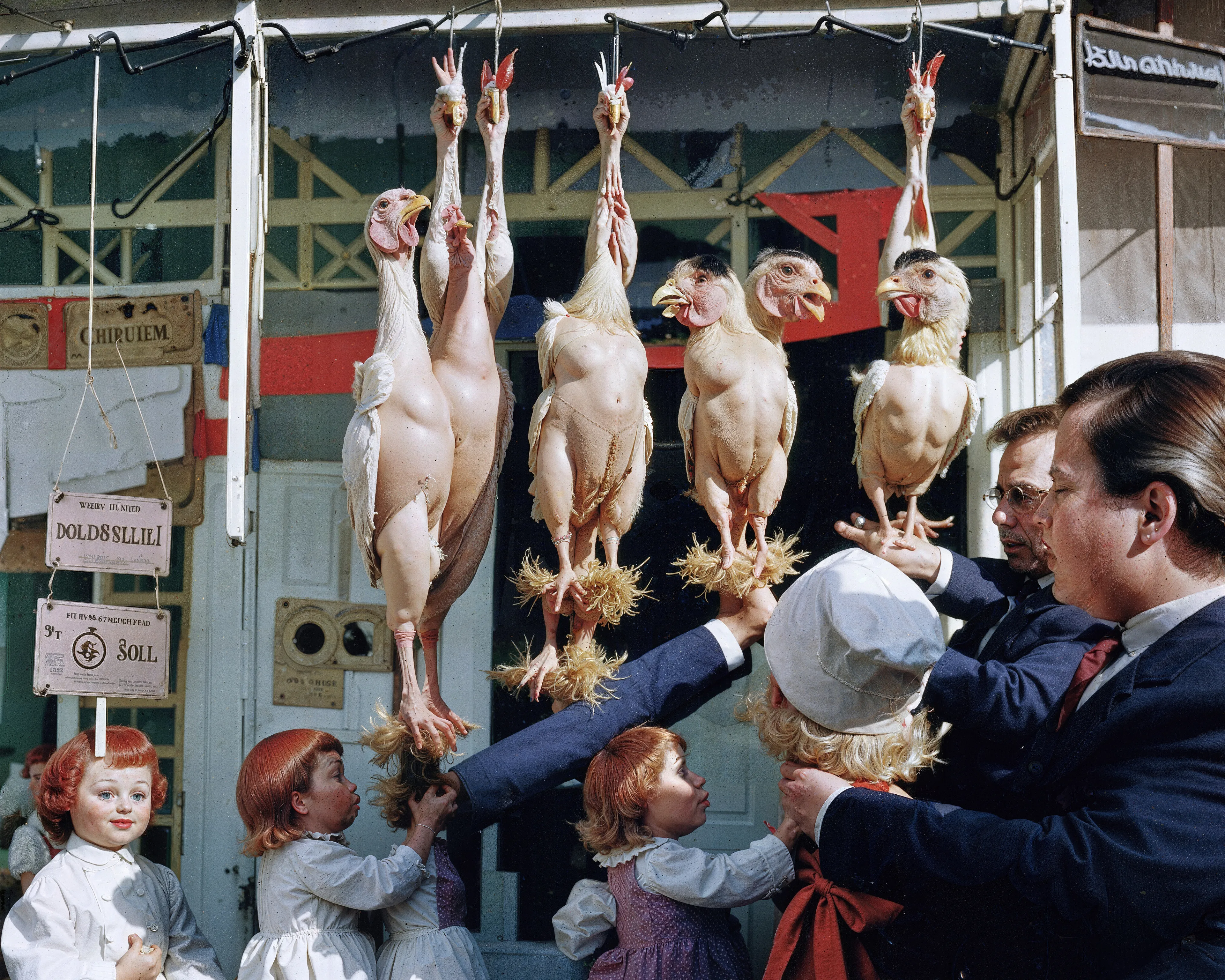 35mm #1: USA, Ohio, 1960s - A man buying chickens at a market
35mm #2: Location unknown, 1980s - China dolls