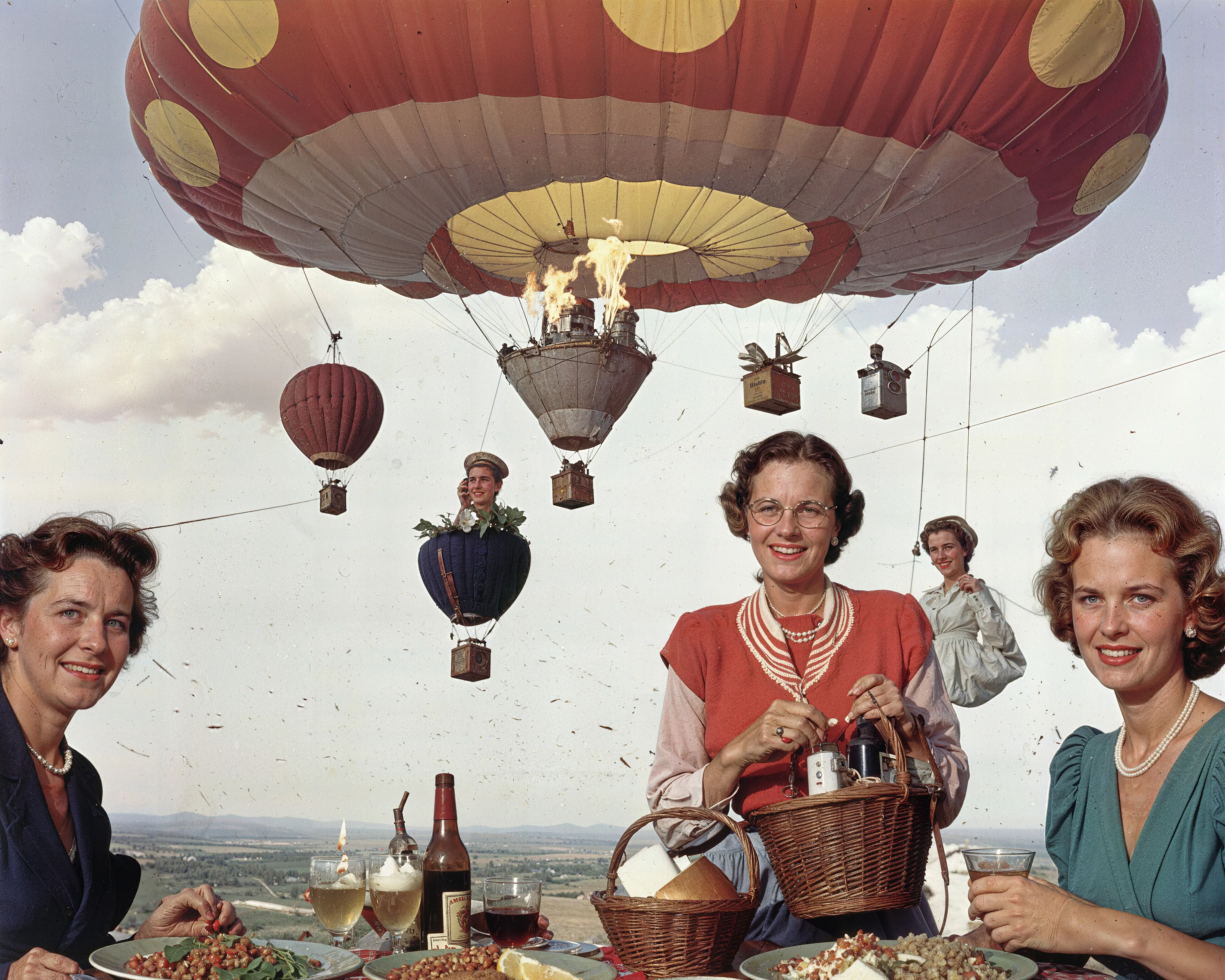 35mm #1: England, Bristol, 1990s - Bristol International Balloon Fiesta
35mm #2: USA, 1950s - Smiling women at a candlelit dinner table