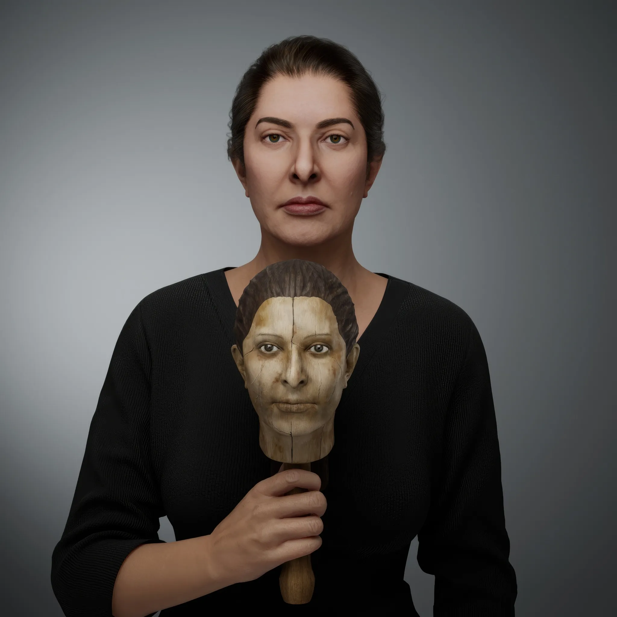 The Mini-me is a doll, a replica of Marina. This double invites exploration of the coexistence of multiple personalities within a single individual, reflecting the complex layers of identity. Another interpretation sees the doll as a preservation of one's inner child—a smaller, vulnerable version of oneself that seeks care, protection, and nurturing. It serves as a poignant reminder of the tender core that remains within us all. Uniquely personal, the doll is not just a copy but an idealised version of Marina Abramović. For this creation, Marina cut her hair to use in its making, infusing the piece with an intimate and deeply symbolic connection to her identity.