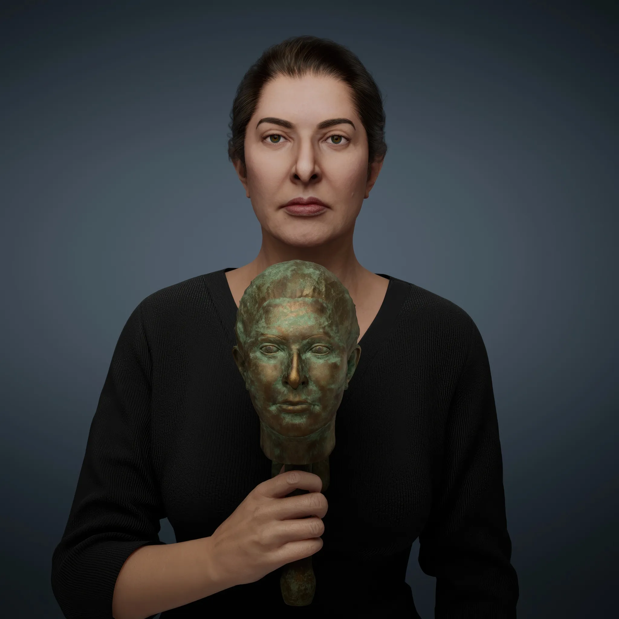 The Mini-me is a doll, a replica of Marina. This double invites exploration of the coexistence of multiple personalities within a single individual, reflecting the complex layers of identity. Another interpretation sees the doll as a preservation of one's inner child—a smaller, vulnerable version of oneself that seeks care, protection, and nurturing. It serves as a poignant reminder of the tender core that remains within us all. Uniquely personal, the doll is not just a copy but an idealised version of Marina Abramović. For this creation, Marina cut her hair to use in its making, infusing the piece with an intimate and deeply symbolic connection to her identity.