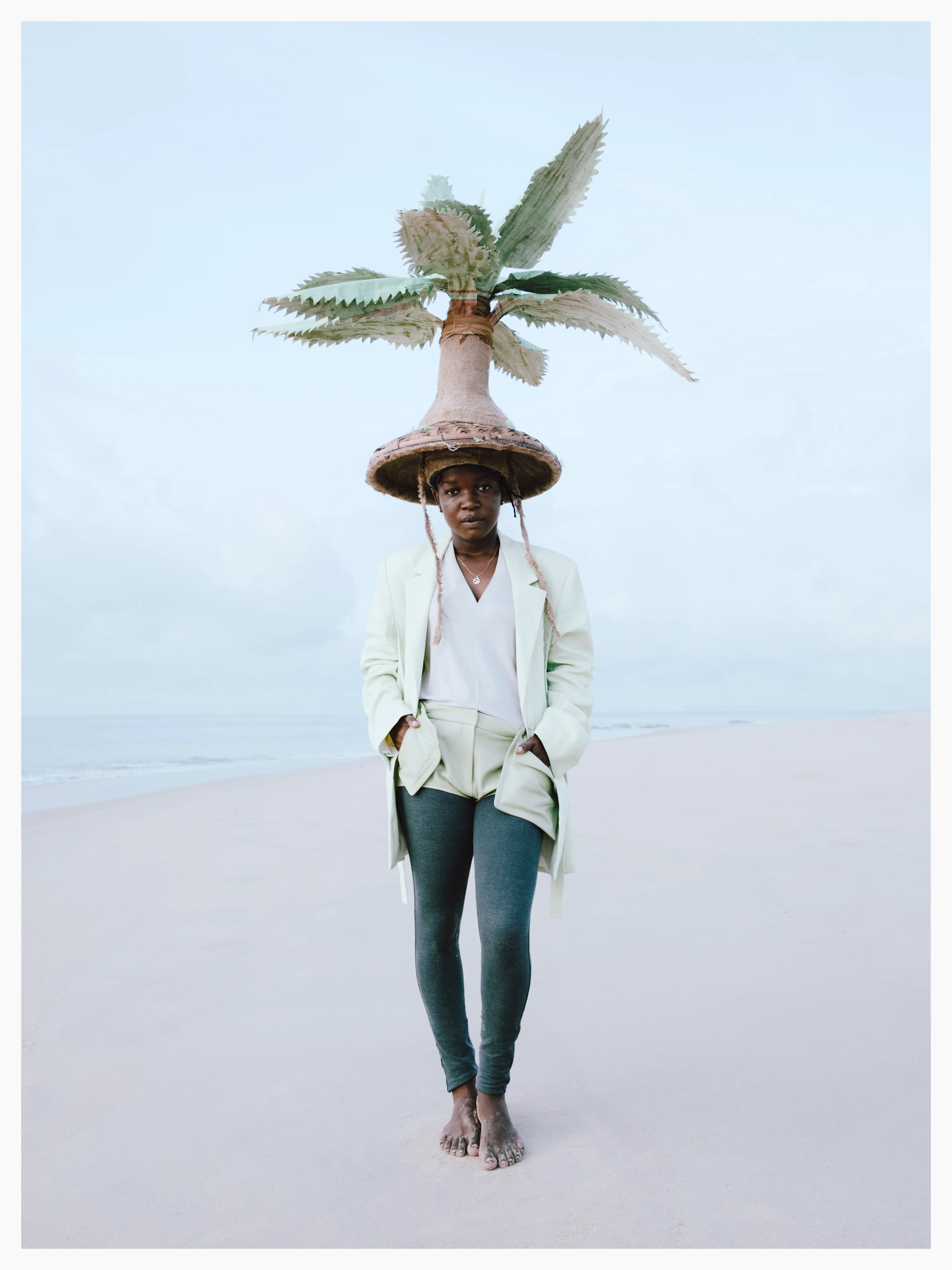 Sarah’s hat is a tribute to the palm trees along the Lamu coast. The ‘trunk’ is crafted from palm tree husks.

Photographed by me, styled by Louise Ford