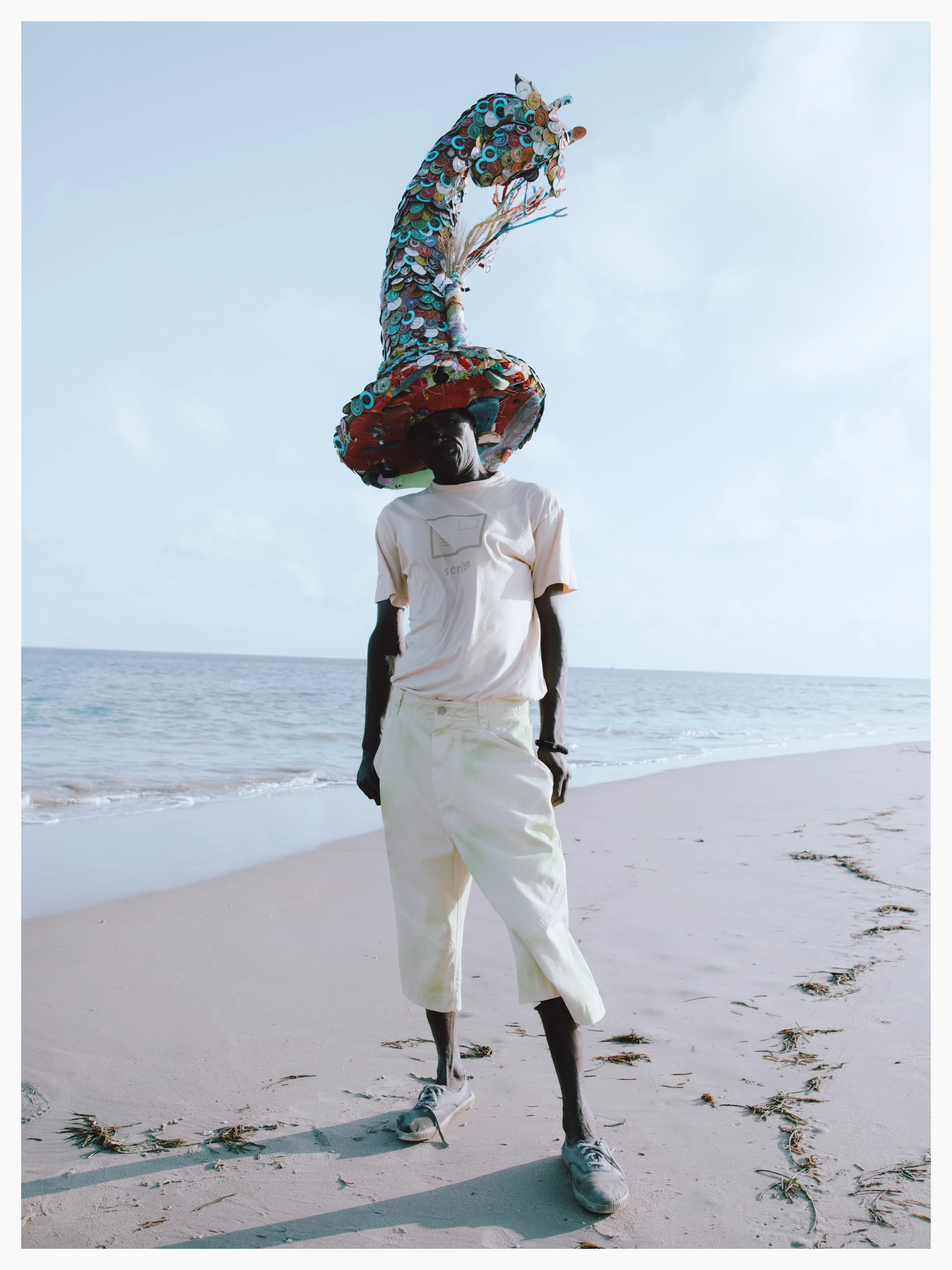 James re-purposed soda bottle caps and used discarded flip-flops to make his giraffe hat.

Photographed by me, styled by Louise Ford