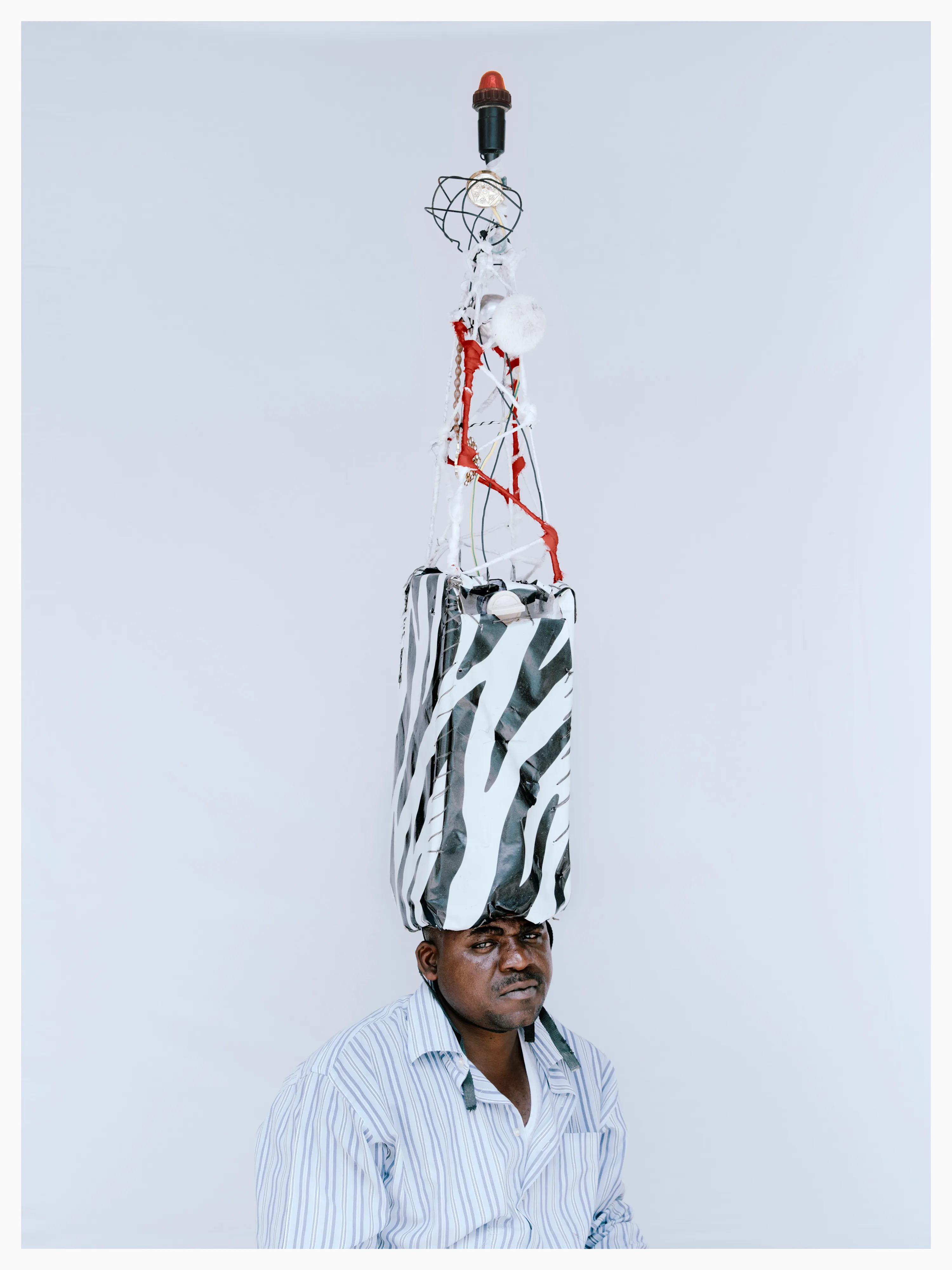Abud’s hat depicts a telecom network tower. Lamu has network connection problems and Abud wanted his hat to raise awareness of this issue.

Photographed by me, styled by Louise Ford