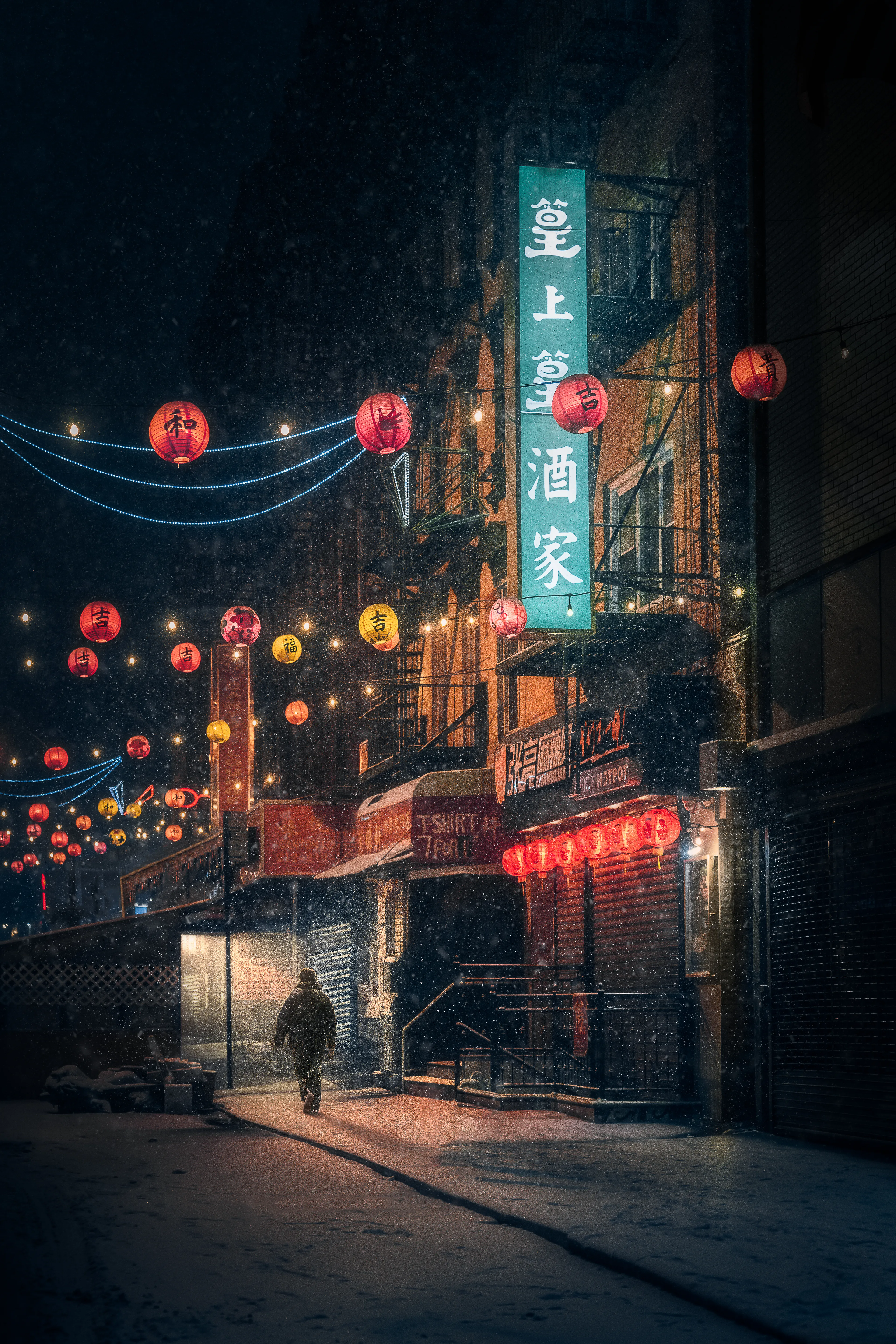 Solitude embraced him, as he walked through the wintry streets of Chinatown. Snow falling gently upon his shoulders, leading him towards the warm embrace of the lantern-lit path ahead.