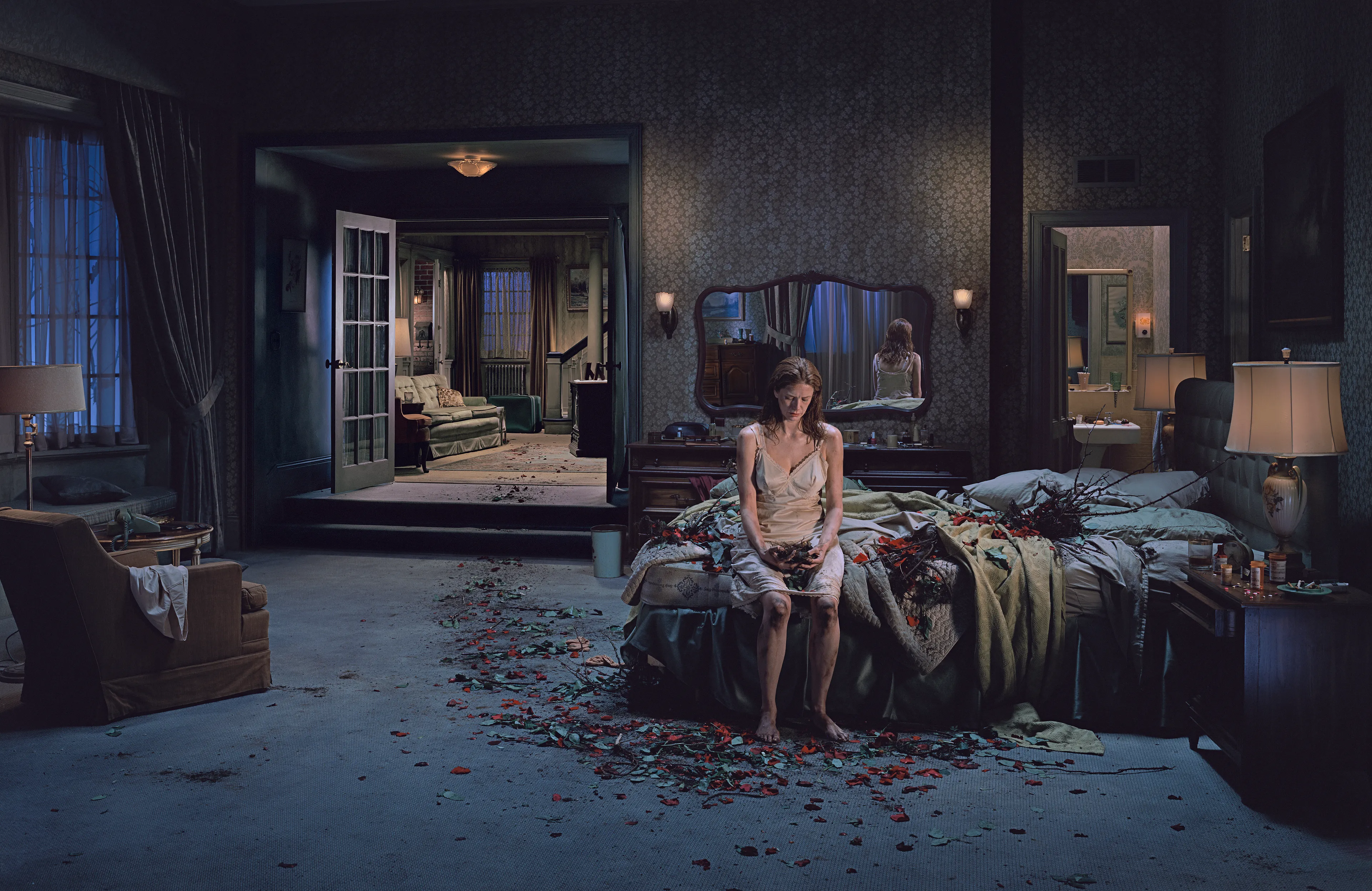 Best known for his elaborately choreographed, large-scale cinematic photographs, Gregory Crewdson is one of the most widely-known American artists working today. The images that comprise Crewdson’s series, Beneath the Roses (2003-2008), take place in the homes, streets, and forests of unnamed small towns. The photographs explore uncanny moments of contemplation within ordinary quotidien life. Made over the course of eight full scale productions spanning five years, with a full feature film-size cinematic crew, the pictures in this series are both epic in scale and intimate in scope, these visually breathtaking photographs blur the distinctions between cinema and photography, reality and fantasy, what has happened, and what is to come. The NFTs include a bundle of 10 items each, including the final artwork, and supporting process materials including 8 x 10 contact prints, black and white 8 x 10 Polaroid studies, production stills, design sketches, and other related ephemera.

Edition: 1 of 1

Set of 10. 
Each set includes 10 images: the final version and 9 supporting images.