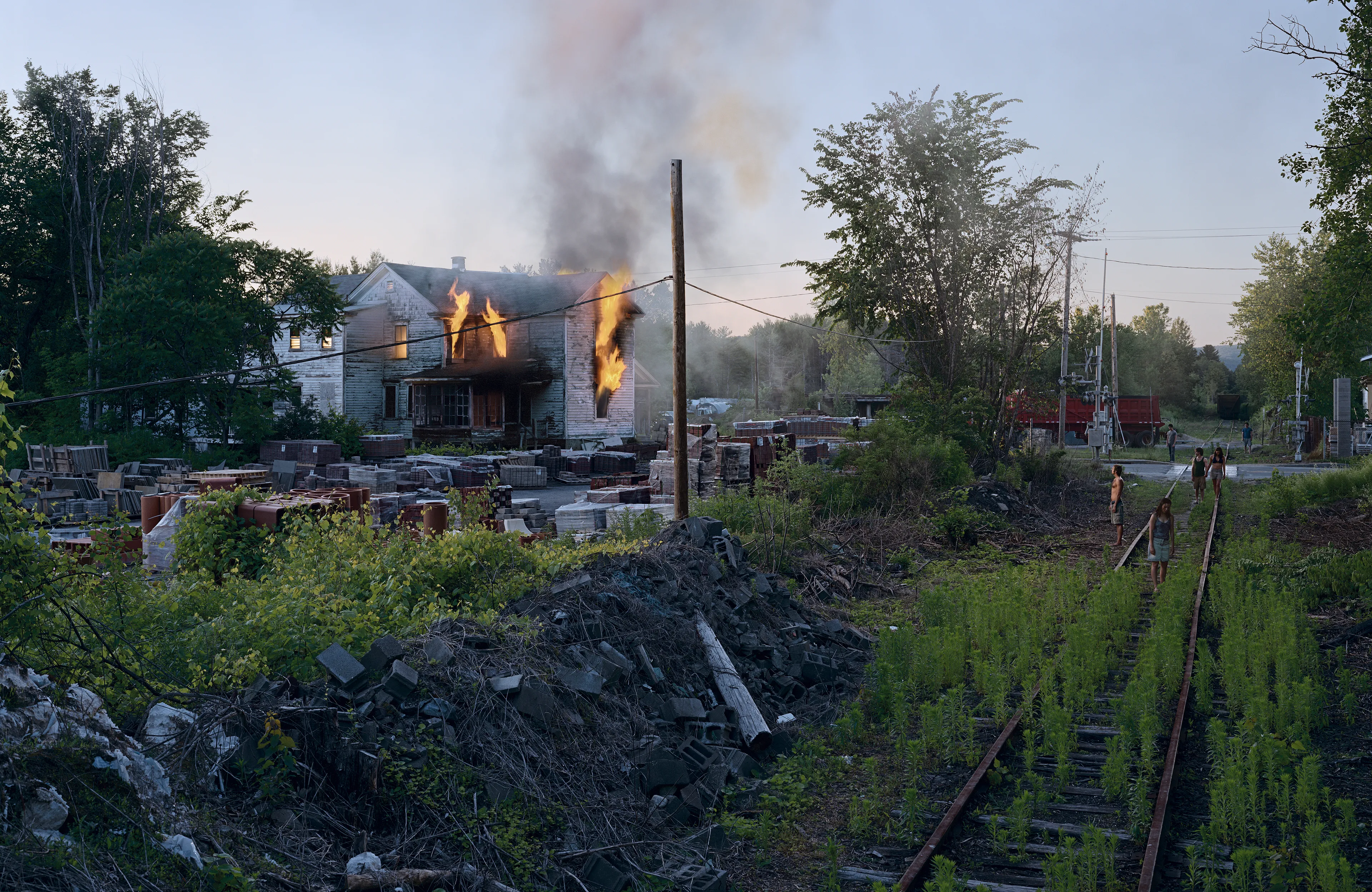 Best known for his elaborately choreographed, large-scale cinematic photographs, Gregory Crewdson is one of the most widely-known American artists working today. The images that comprise Crewdson’s series, Beneath the Roses (2003-2008), take place in the homes, streets, and forests of unnamed small towns. The photographs explore uncanny moments of contemplation within ordinary quotidien life. Made over the course of eight full scale productions spanning five years, with a full feature film-size cinematic crew, the pictures in this series are both epic in scale and intimate in scope, these visually breathtaking photographs blur the distinctions between cinema and photography, reality and fantasy, what has happened, and what is to come. The NFTs include a bundle of 10 items each, including the final artwork, and supporting process materials including 8 x 10 contact prints, black and white 8 x 10 Polaroid studies, production stills, design sketches, and other related ephemera.

Edition: 1 of 1

Set of 10. 
Each set includes 10 images: the final version and 9 supporting images.