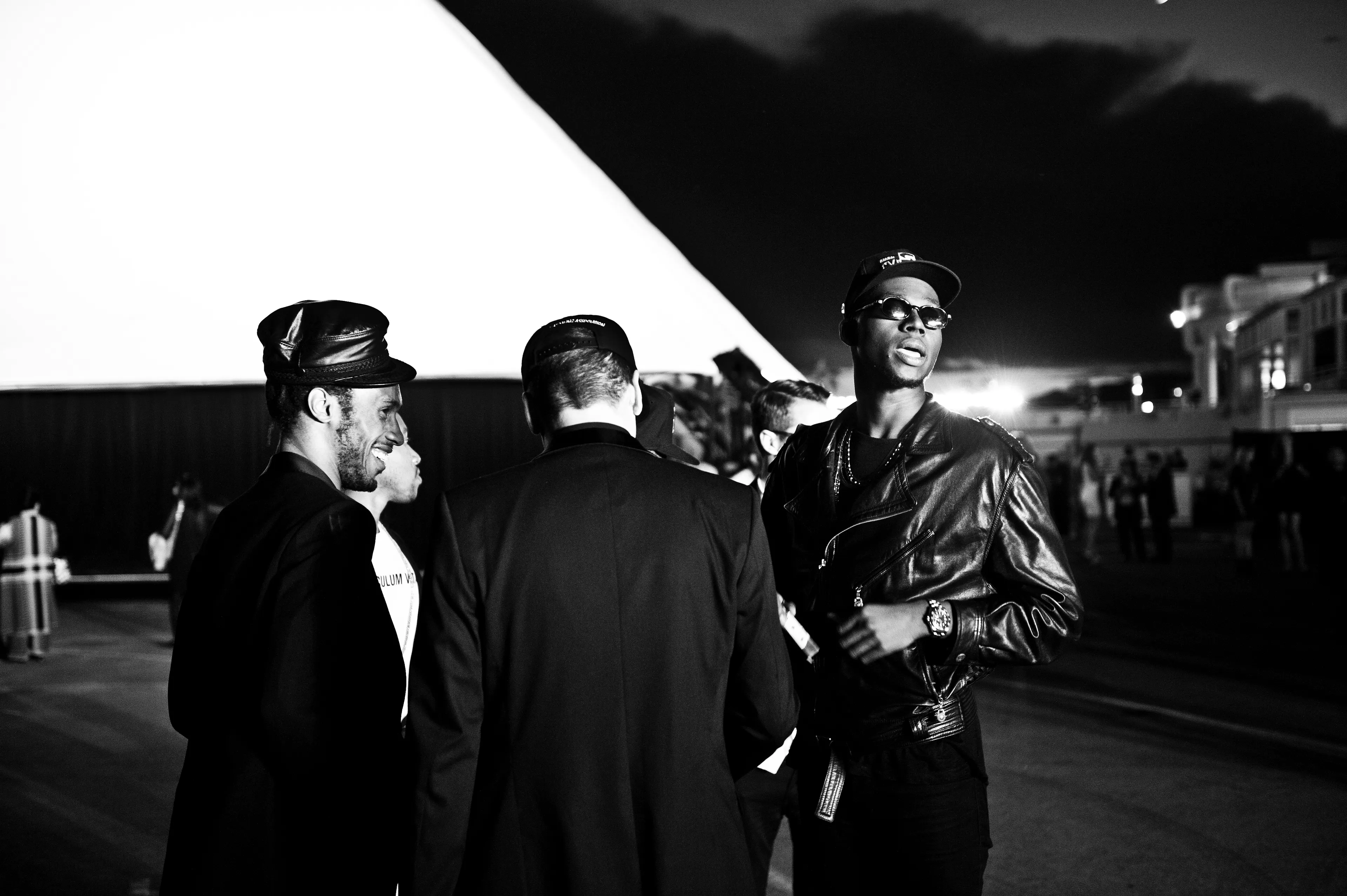 At the premiere of Kanye West’s short film, the theatre was set up with seven screens. This was shot outside of the theatre which was inside a white tent. I don’t know this group of guests but was drawn to the geometric shape of the tent contrasting the seaside and beach nearby.