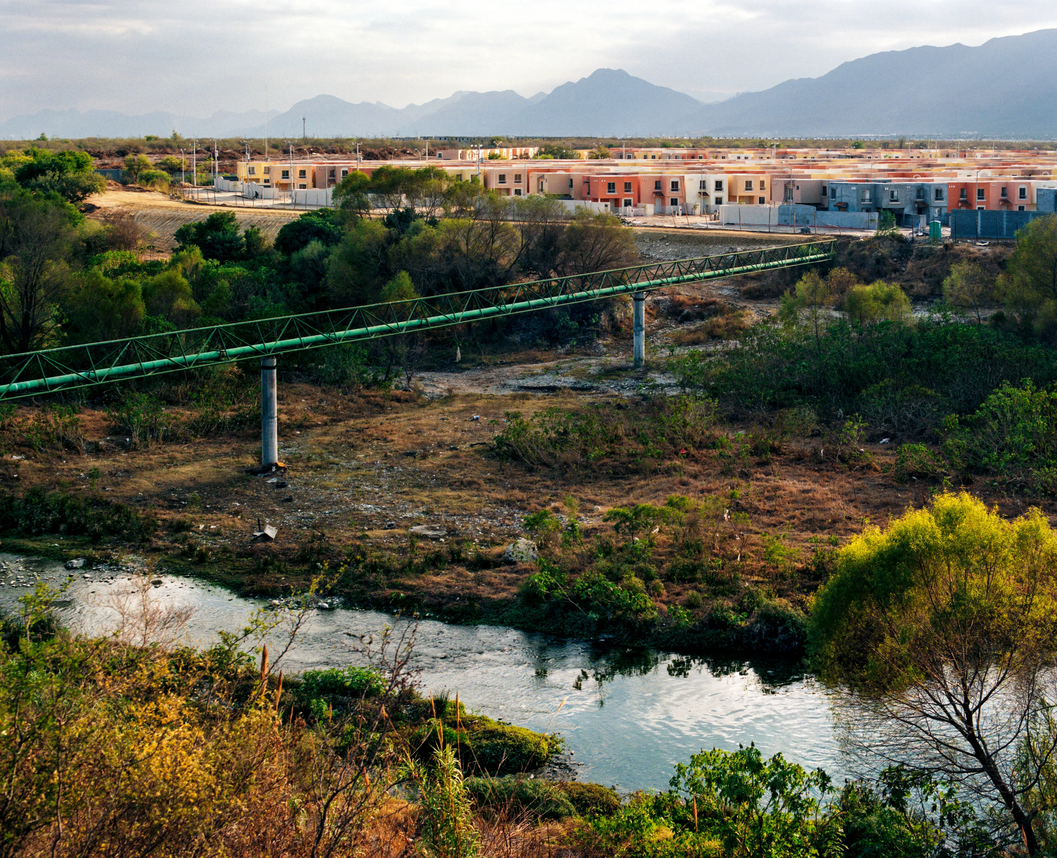 State of Nuevo León, Mexico, 2005-2010. This image is part of a 5-year project called Suburbia Mexicana. I wanted to document some of the unintended consequences of the housing bubble many cities in Mexico were going through. I was also very interested in the aesthetic questions posed by using ultra beautiful landscape imagery to represent ecological degradation. It is a nod to the romantic use of tragedy in paintings; a visual exploration of the grandeur of disaster as a way to comment on the other side of Mexico’s copy pasted ideals of homeownership.