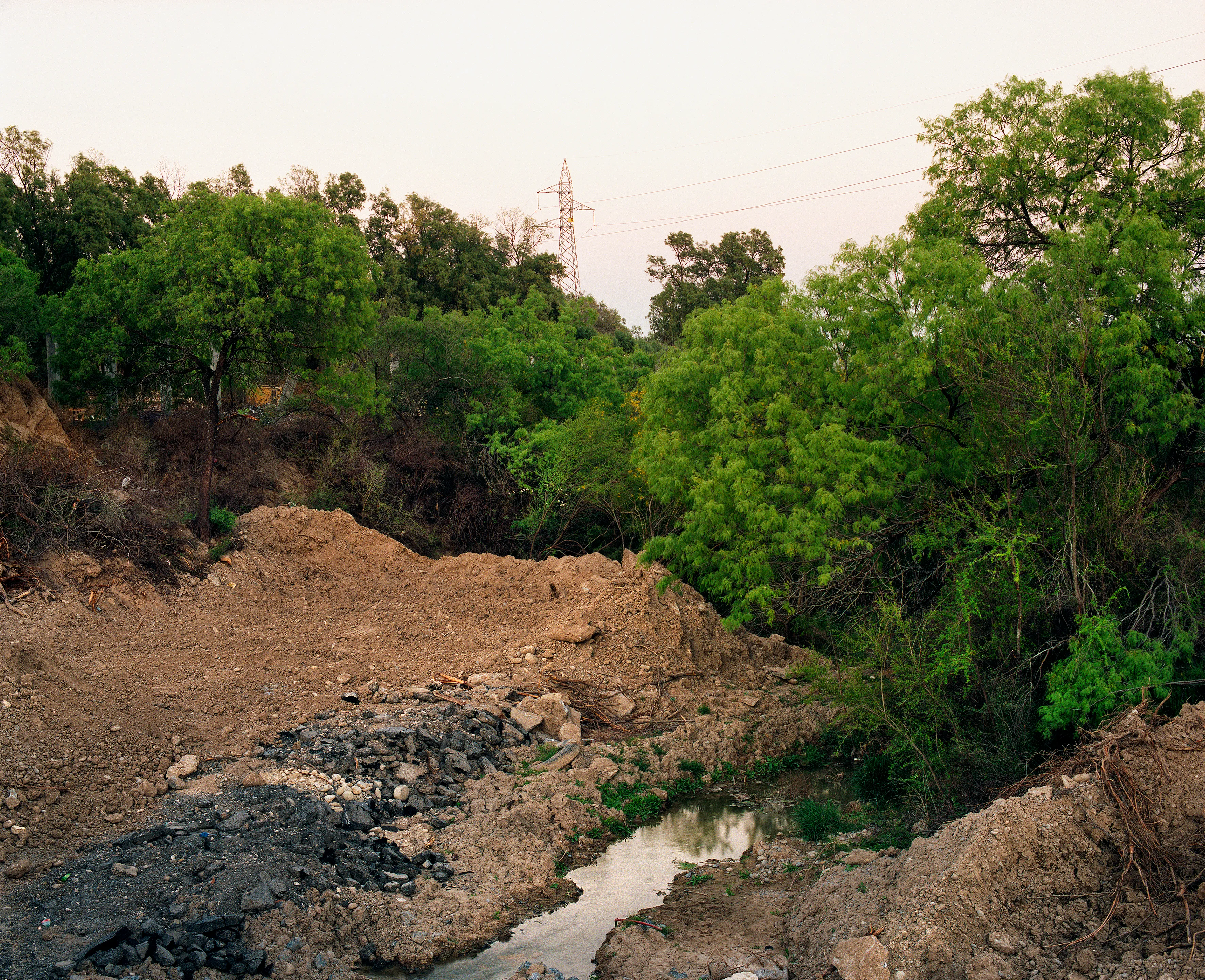 State of Nuevo León, Mexico, 2005-2010. This image is part of a 5-year project called Suburbia Mexicana. I wanted to document some of the unintended consequences of the housing bubble many cities in Mexico were going through. I was also very interested in the aesthetic questions posed by using ultra beautiful landscape imagery to represent ecological degradation. It is a nod to the romantic use of tragedy in paintings; a visual exploration of the grandeur of disaster as a way to comment on the other side of Mexico’s copy pasted ideals of homeownership.