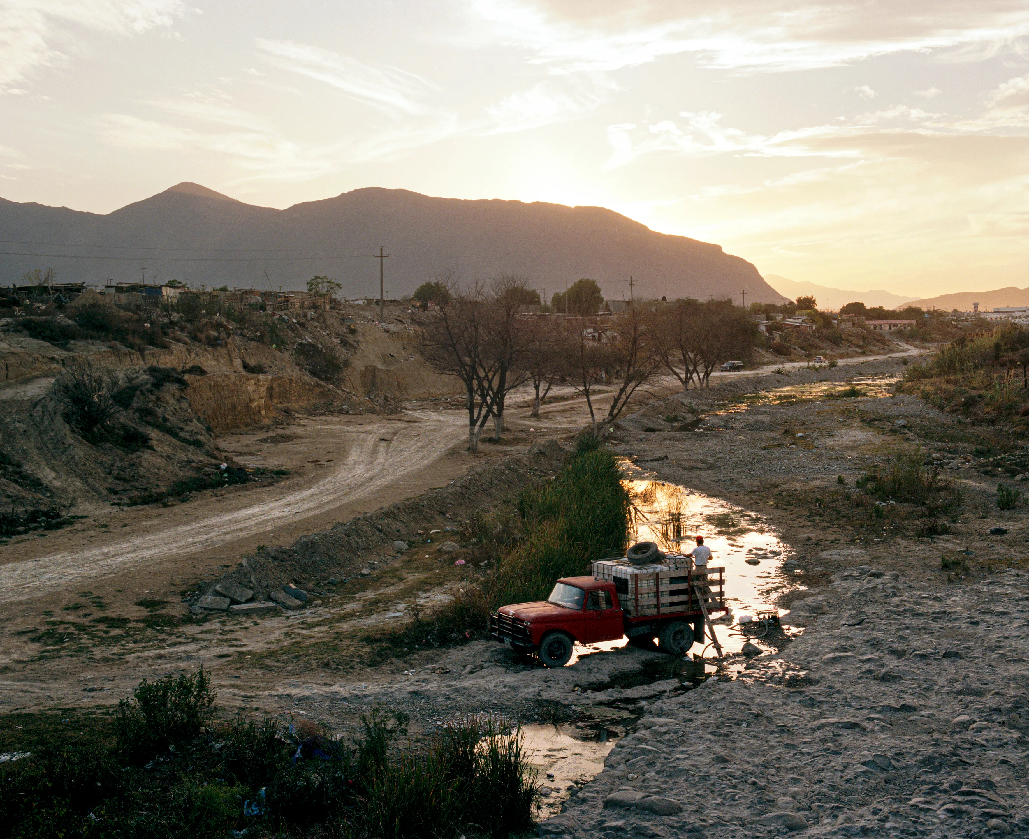 State of Nuevo León, Mexico, 2005-2010. This image is part of a 5-year project called Suburbia Mexicana. I wanted to document some of the unintended consequences of the housing bubble many cities in Mexico were going through. I was also very interested in the aesthetic questions posed by using ultra beautiful landscape imagery to represent ecological degradation. It is a nod to the romantic use of tragedy in paintings; a visual exploration of the grandeur of disaster as a way to comment on the other side of Mexico’s copy pasted ideals of homeownership.