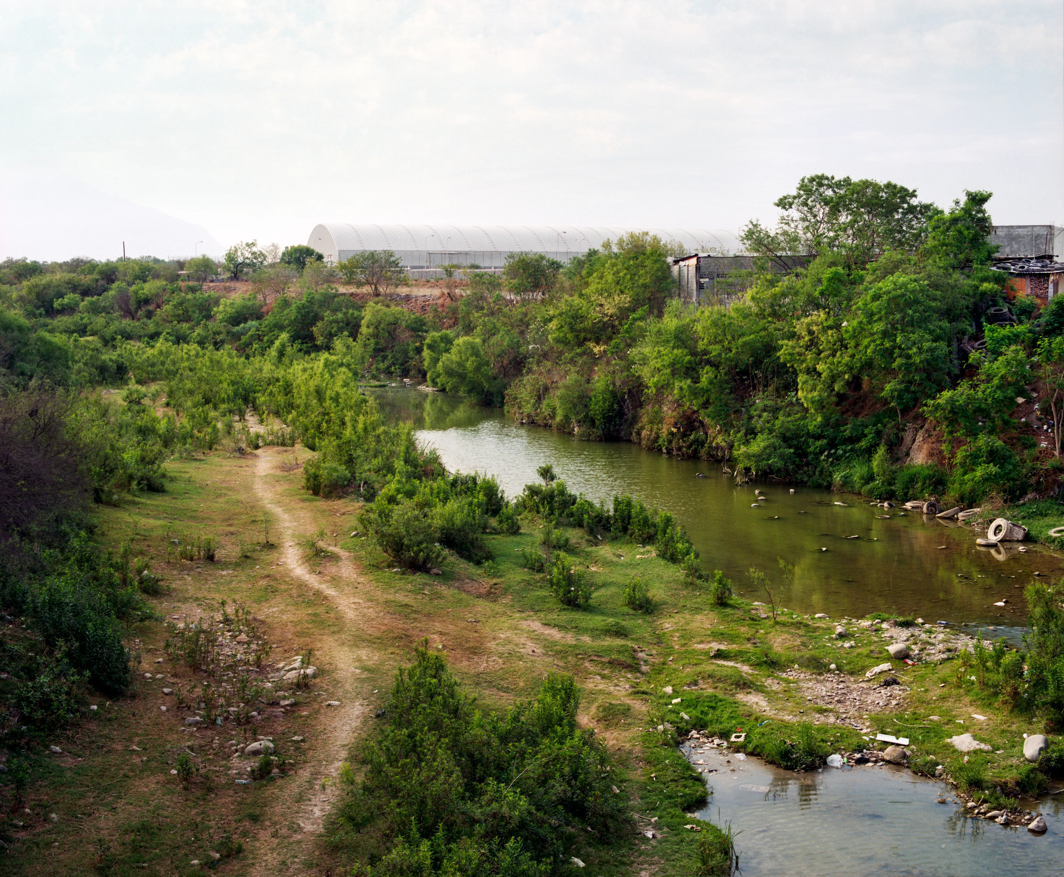 State of Nuevo León, Mexico, 2005-2010. This image is part of a 5-year project called Suburbia Mexicana. I wanted to document some of the unintended consequences of the housing bubble many cities in Mexico were going through. I was also very interested in the aesthetic questions posed by using ultra beautiful landscape imagery to represent ecological degradation. It is a nod to the romantic use of tragedy in paintings; a visual exploration of the grandeur of disaster as a way to comment on the other side of Mexico’s copy pasted ideals of homeownership.