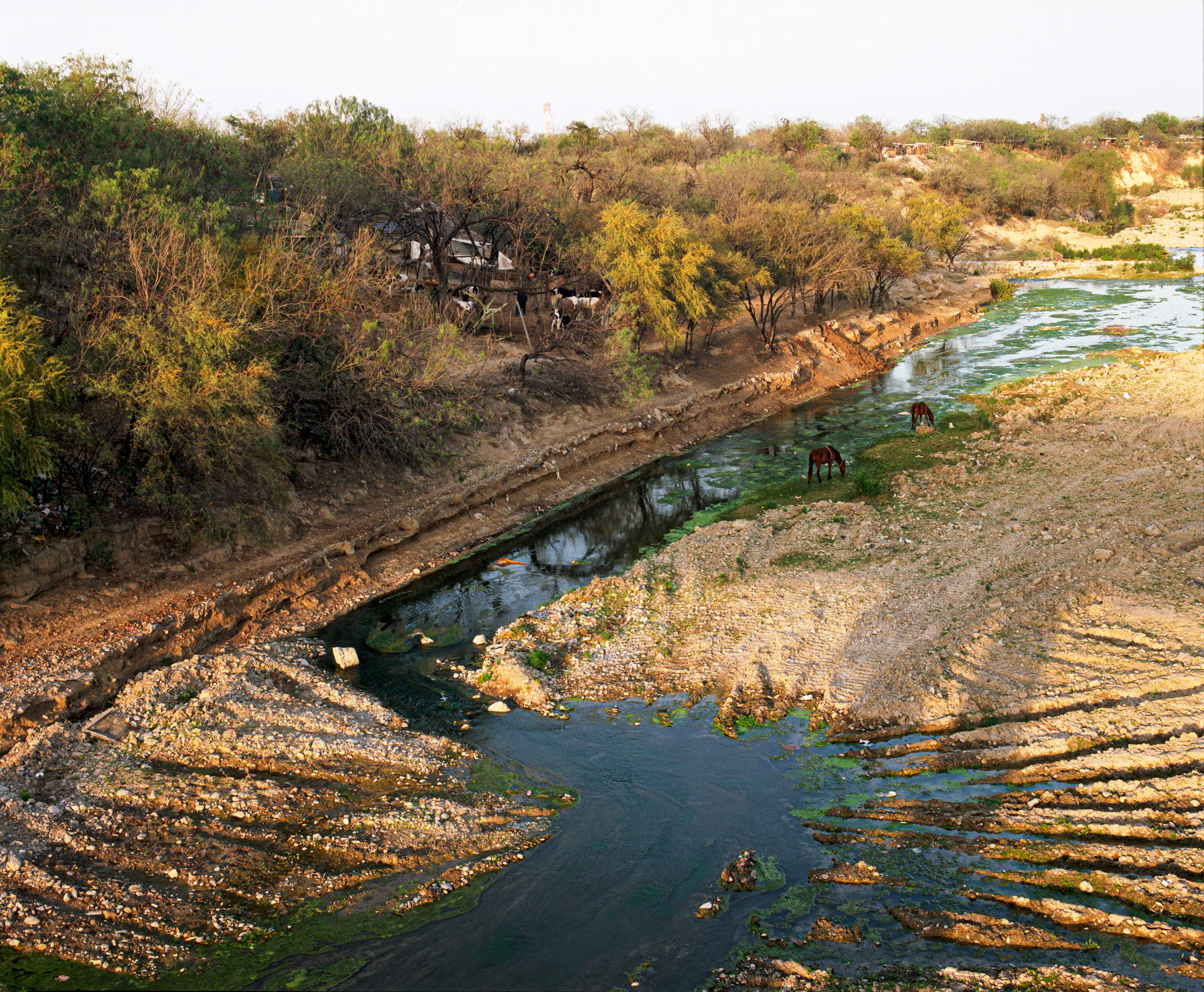 State of Nuevo León, Mexico, 2005-2010. This image is part of a 5-year project called Suburbia Mexicana. I wanted to document some of the unintended consequences of the housing bubble many cities in Mexico were going through. I was also very interested in the aesthetic questions posed by using ultra beautiful landscape imagery to represent ecological degradation. It is a nod to the romantic use of tragedy in paintings; a visual exploration of the grandeur of disaster as a way to comment on the other side of Mexico’s copy pasted ideals of homeownership.