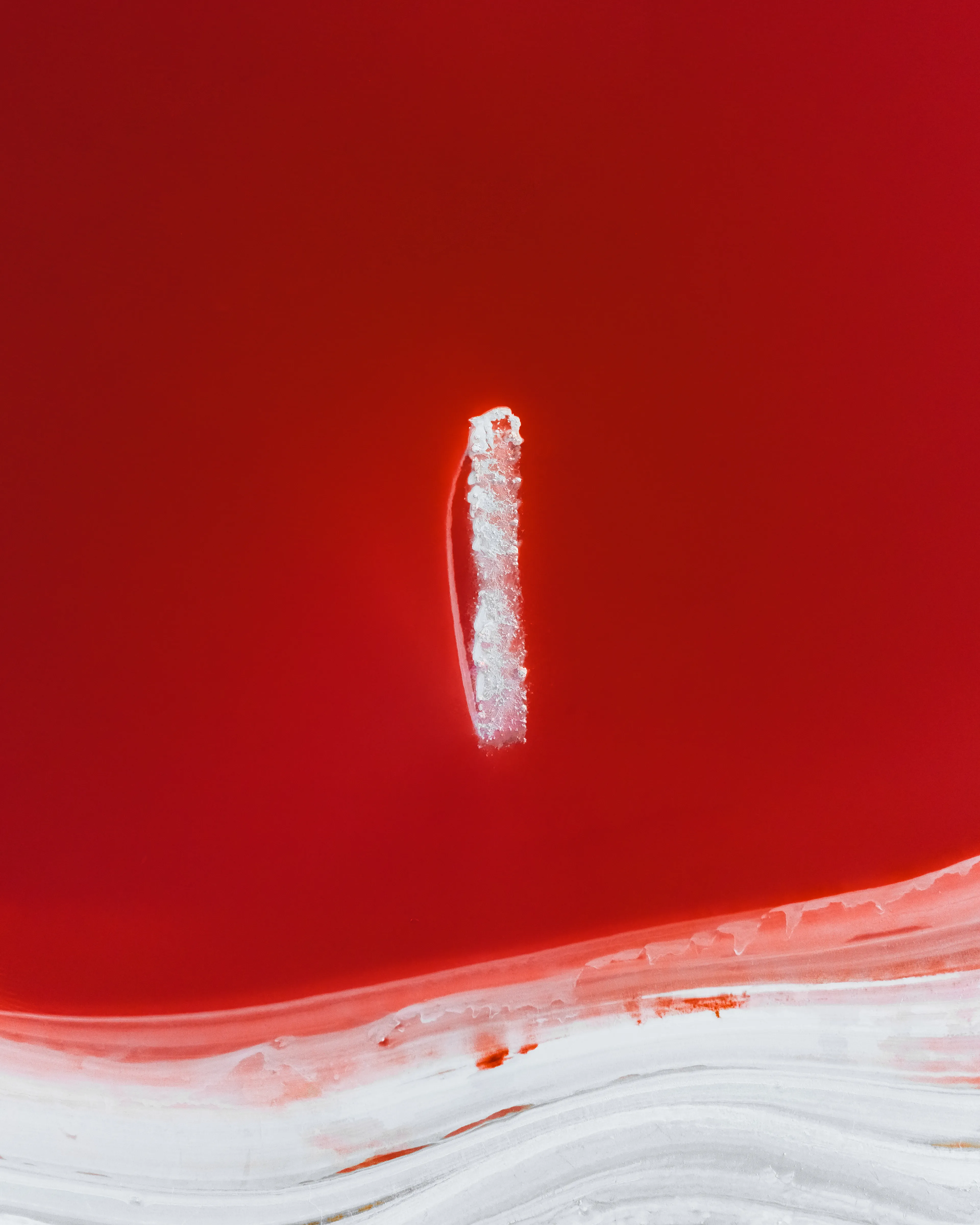 After a wet winter in South Australia, this salt lake had filled with water to create a vibrant red colour. The salt water was at just the right level to expose what looked like a large monolith. Salt lake photography can be viewed differently be everyone, but in this image I see a crystallised monolith suspended above the ground in a sky of red. Something not even I could create in my imagination, yet it was right in front of me created by nature. I’m often humbled by the reminder that nature can create the most magical scenes and I feel honoured to share their beauty.

Unlikely salt lake subjects come in all forms, and you often can’t plan for what you’ll come across. To find unusual subjects to photograph with my drone, I spend my time searching on google maps for things that catch my attention. While researching this particular cluster of salt lakes in South Australia, what appeared to be a giant mound of crystallised salt caught my eye. You can never be sure if what you see on google maps will look anything close to how you imagine it, but this particular location exceeded my expectations.