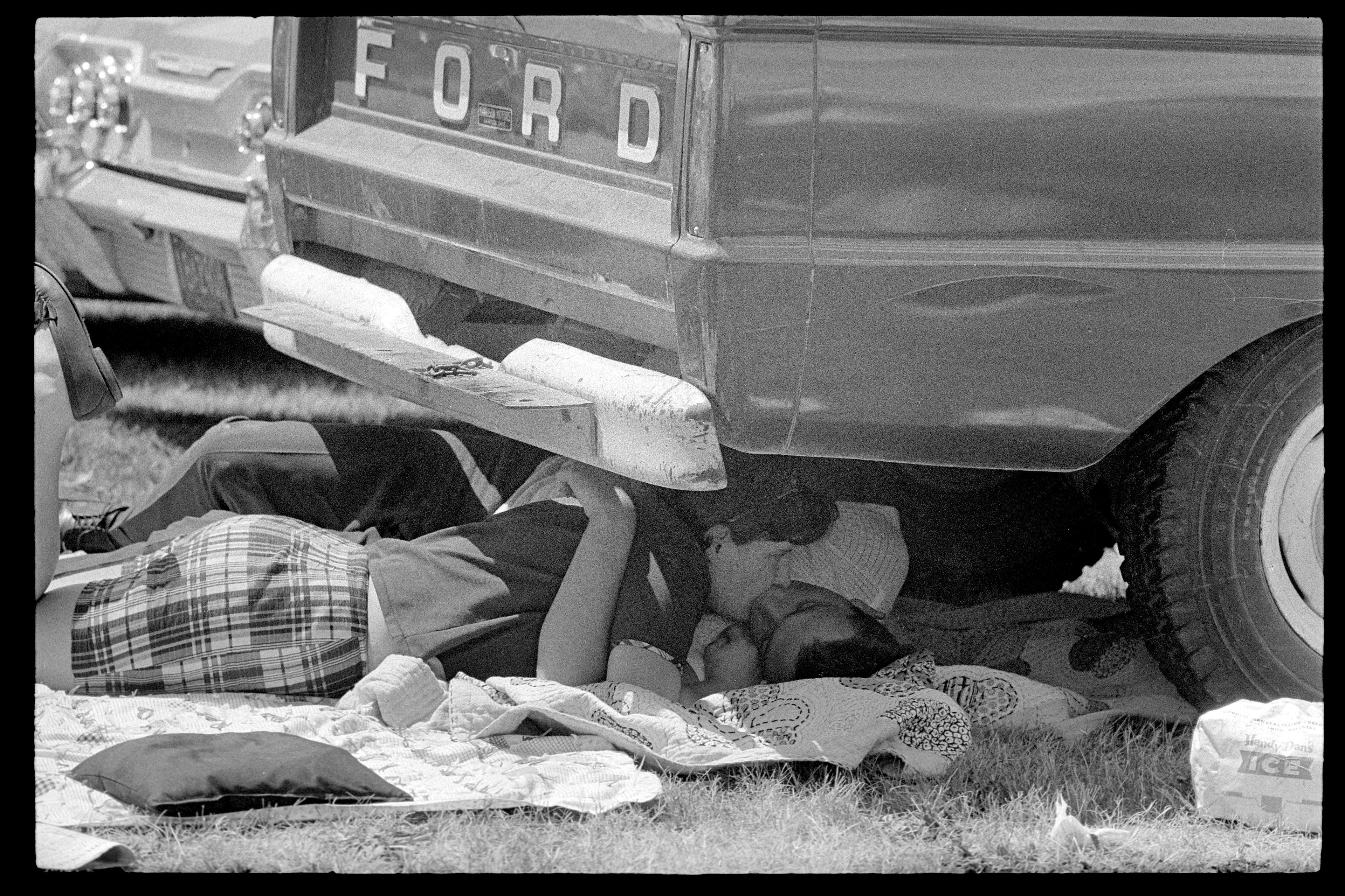 Indy 500, Couple Under Car, Indianapolis, Indiana, USA, 1965

