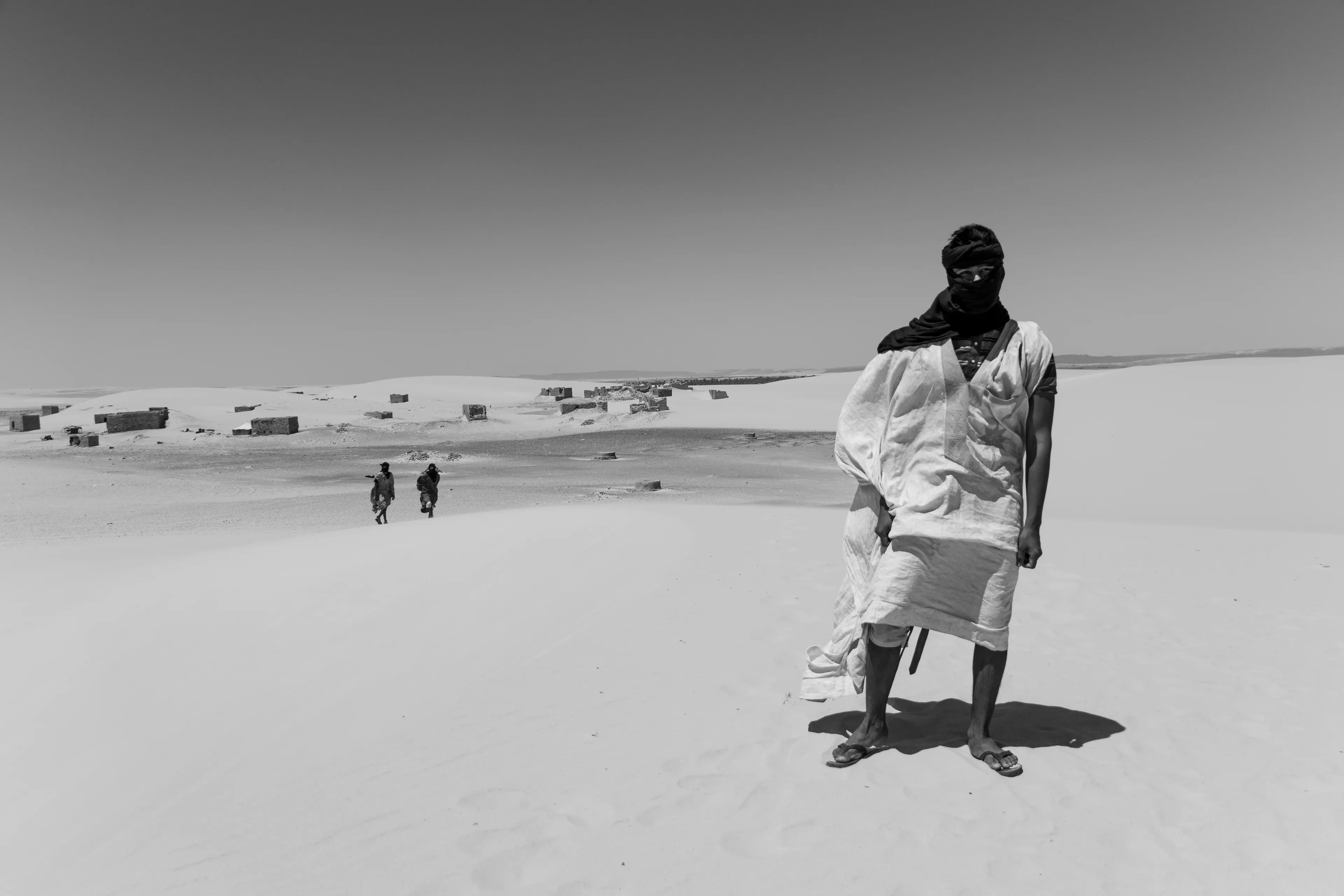 Standing in Akreijit’s vast background...small but powerful presence in the desert landscape.