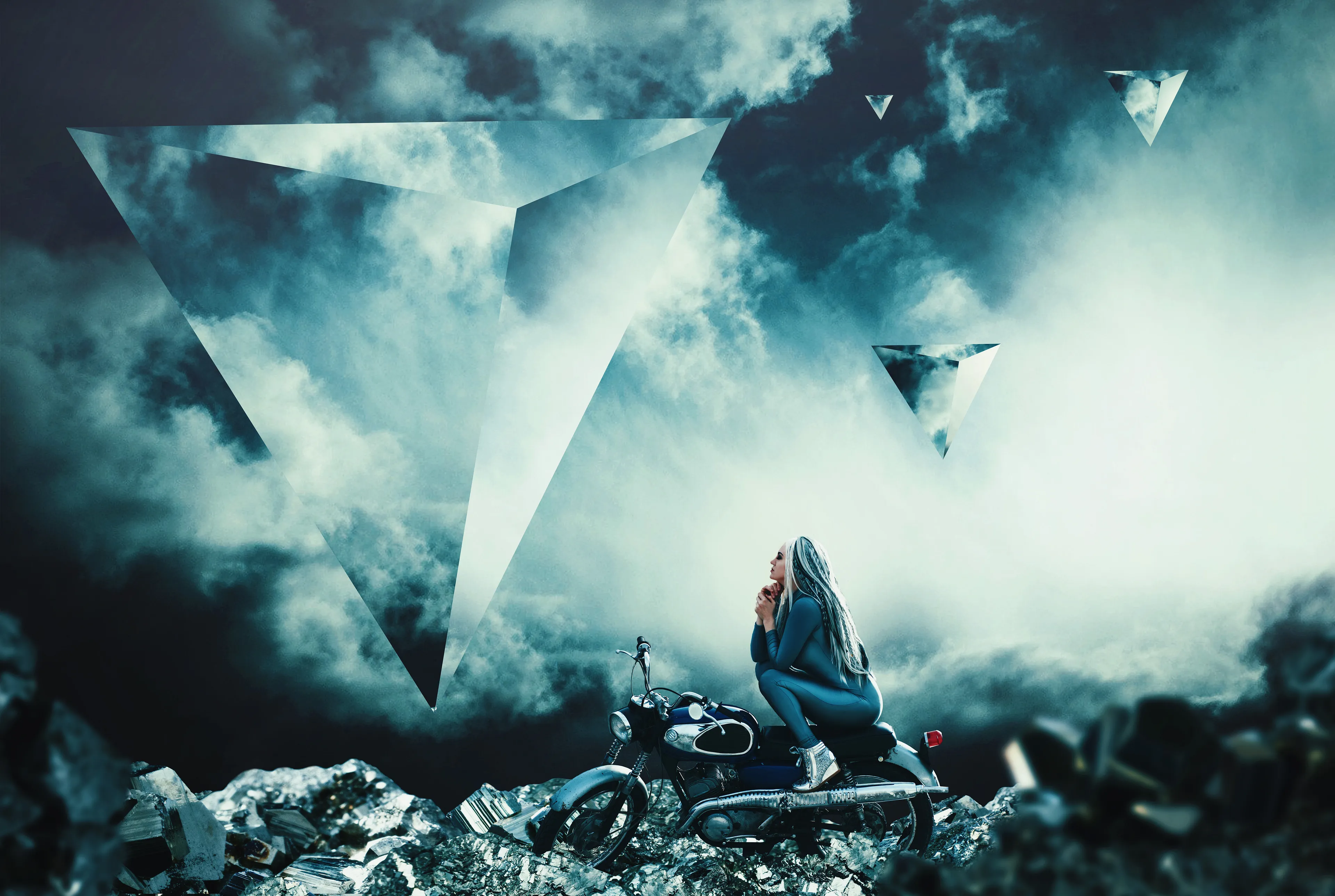 Welcome to Mirer. A place where all you want is mirrored back to you. Reflected dreams float in the sky, easily colliding and shattering. The ground is covered with jagged shards, bright boulders and fine, metallic dust.  If you go there, know what you truly want. But do not stay. Being idle while dreaming is dangerous.