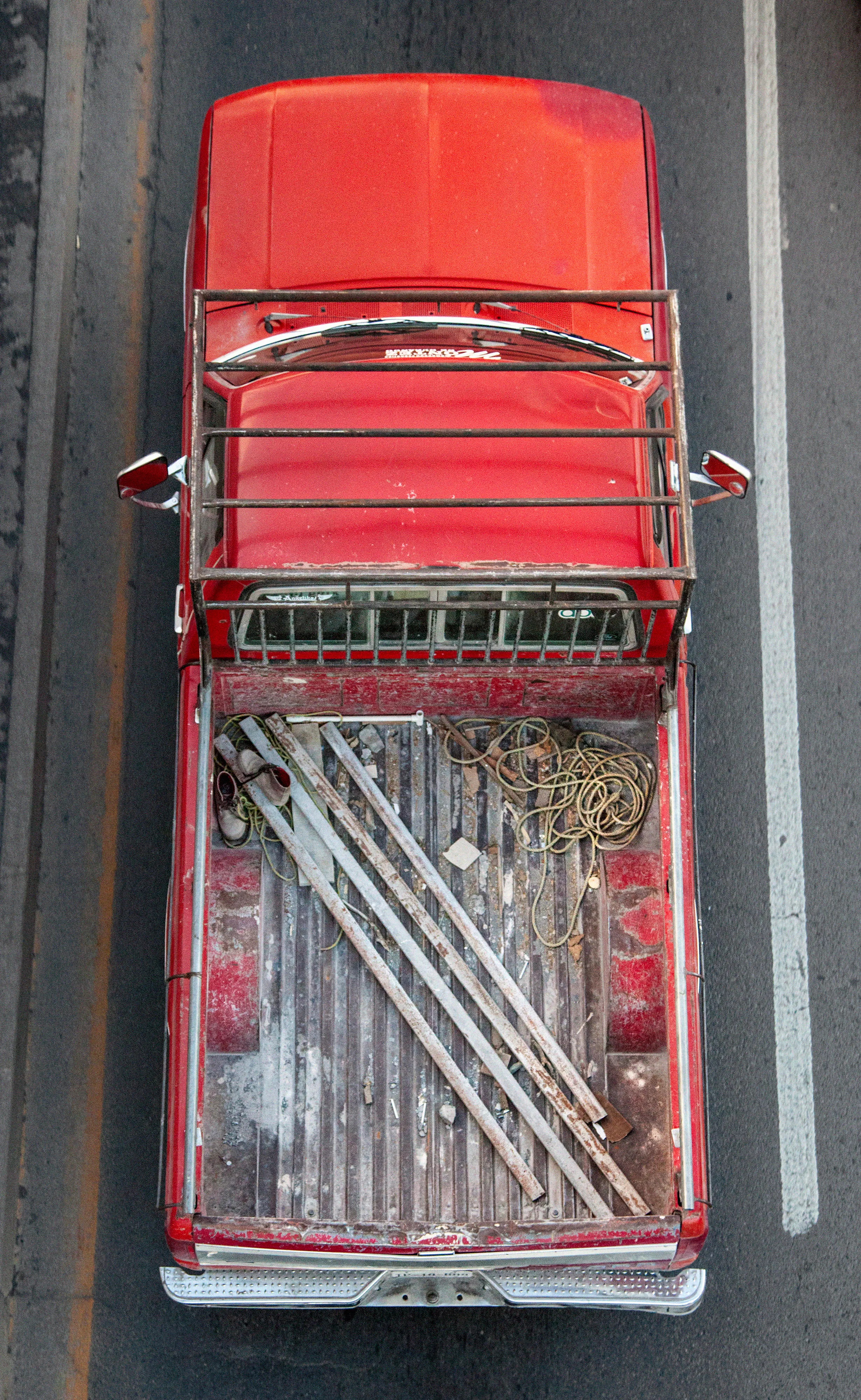 In Urban Transportation, Cartagena focuses on various modes of transportation used by workers in urban environments, particularly highlighting the ubiquitous red trucks. Shooting cars and trucks as they drive to work in the morning, Cartagena has been able to capture a stunning snapshot of what is the daily routine of a city. The colors and textures of the vehicles and objects, mixed with the contemporary idea of customizing vehicles make for arresting imagery of a contemporary Mexican city.