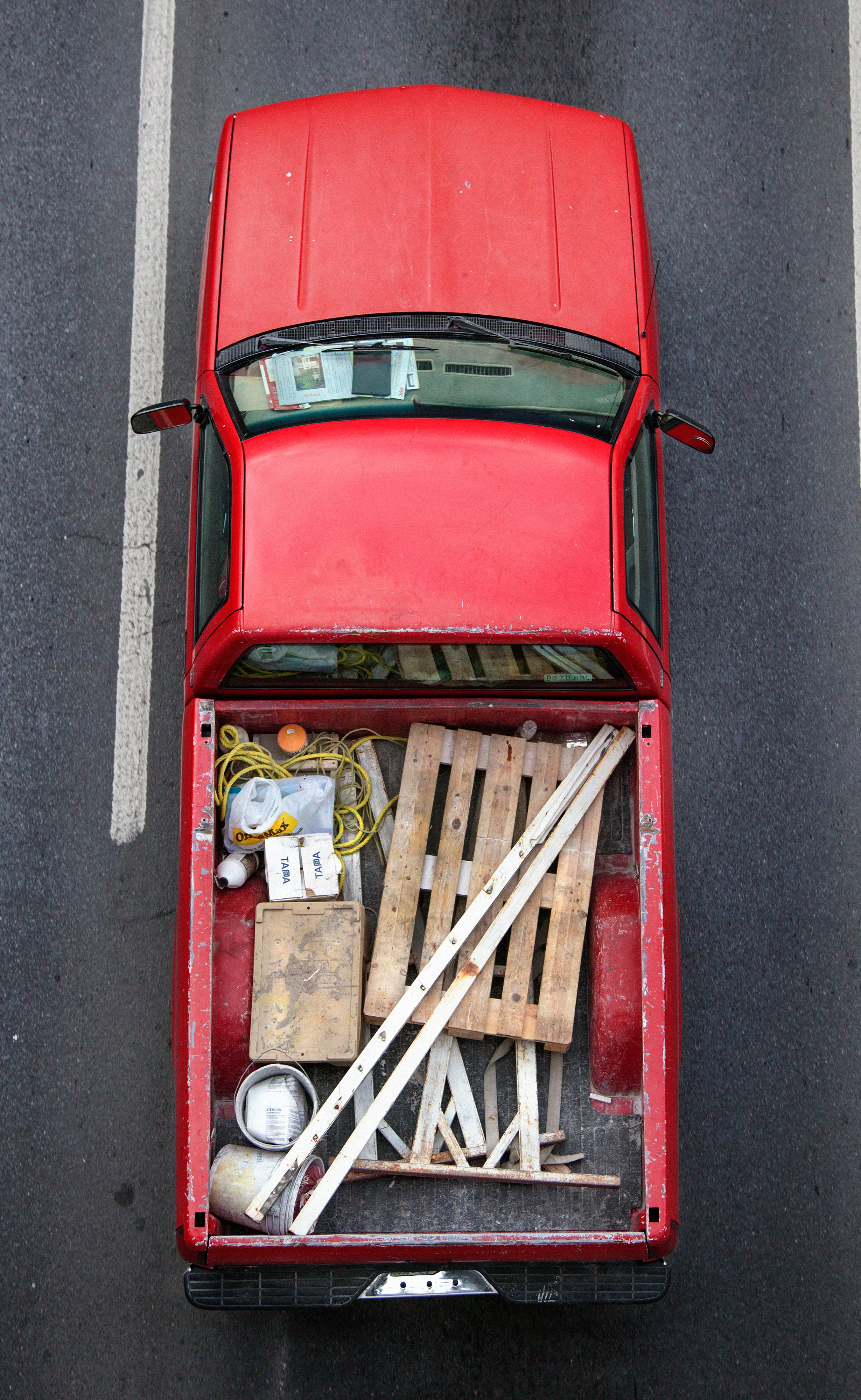 In Urban Transportation, Cartagena focuses on various modes of transportation used by workers in urban environments, particularly highlighting the ubiquitous red trucks. Shooting cars and trucks as they drive to work in the morning, Cartagena has been able to capture a stunning snapshot of what is the daily routine of a city. The colors and textures of the vehicles and objects, mixed with the contemporary idea of customizing vehicles make for arresting imagery of a contemporary Mexican city.