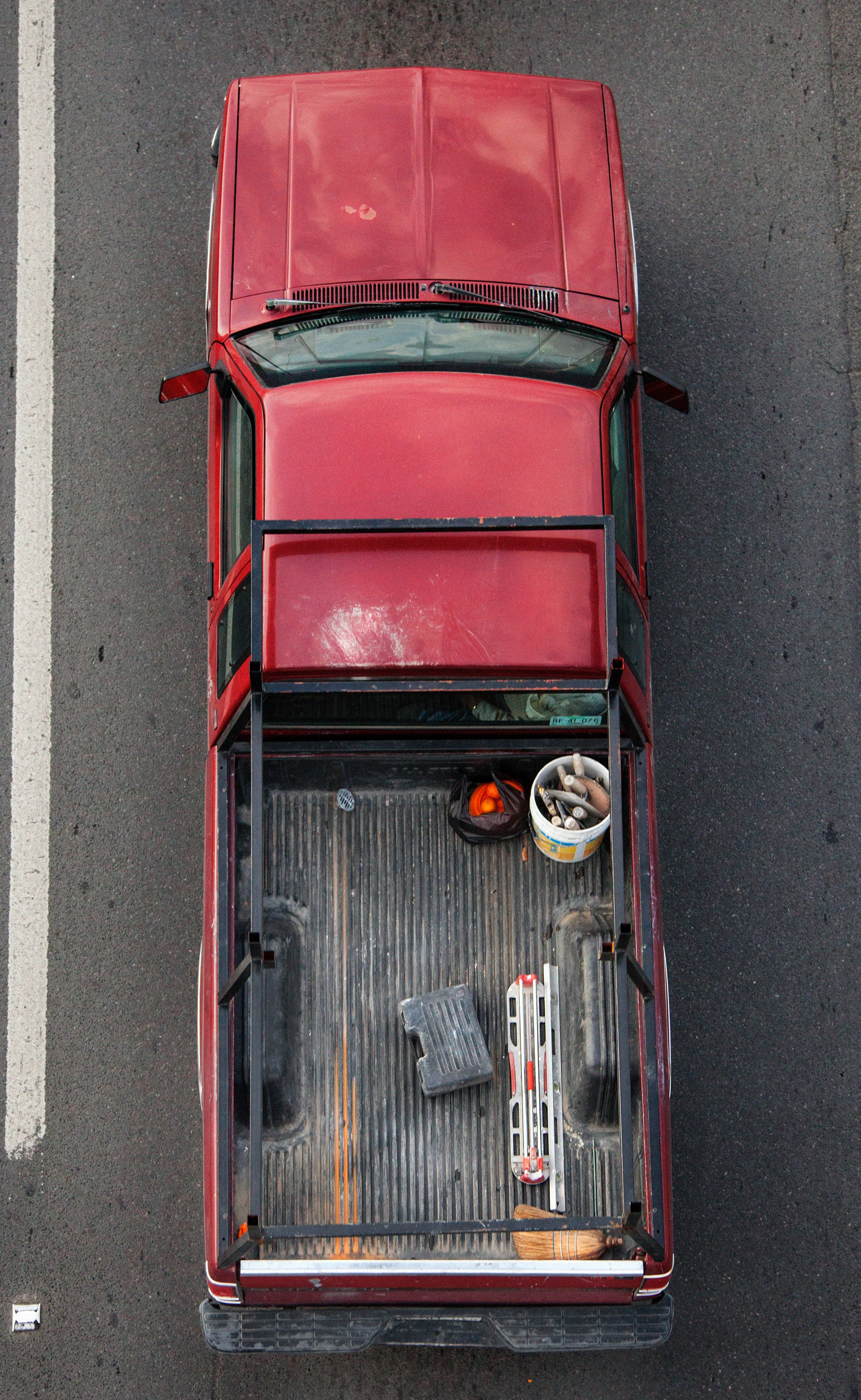 In Urban Transportation, Cartagena focuses on various modes of transportation used by workers in urban environments, particularly highlighting the ubiquitous red trucks. Shooting cars and trucks as they drive to work in the morning, Cartagena has been able to capture a stunning snapshot of what is the daily routine of a city. The colors and textures of the vehicles and objects, mixed with the contemporary idea of customizing vehicles make for arresting imagery of a contemporary Mexican city.