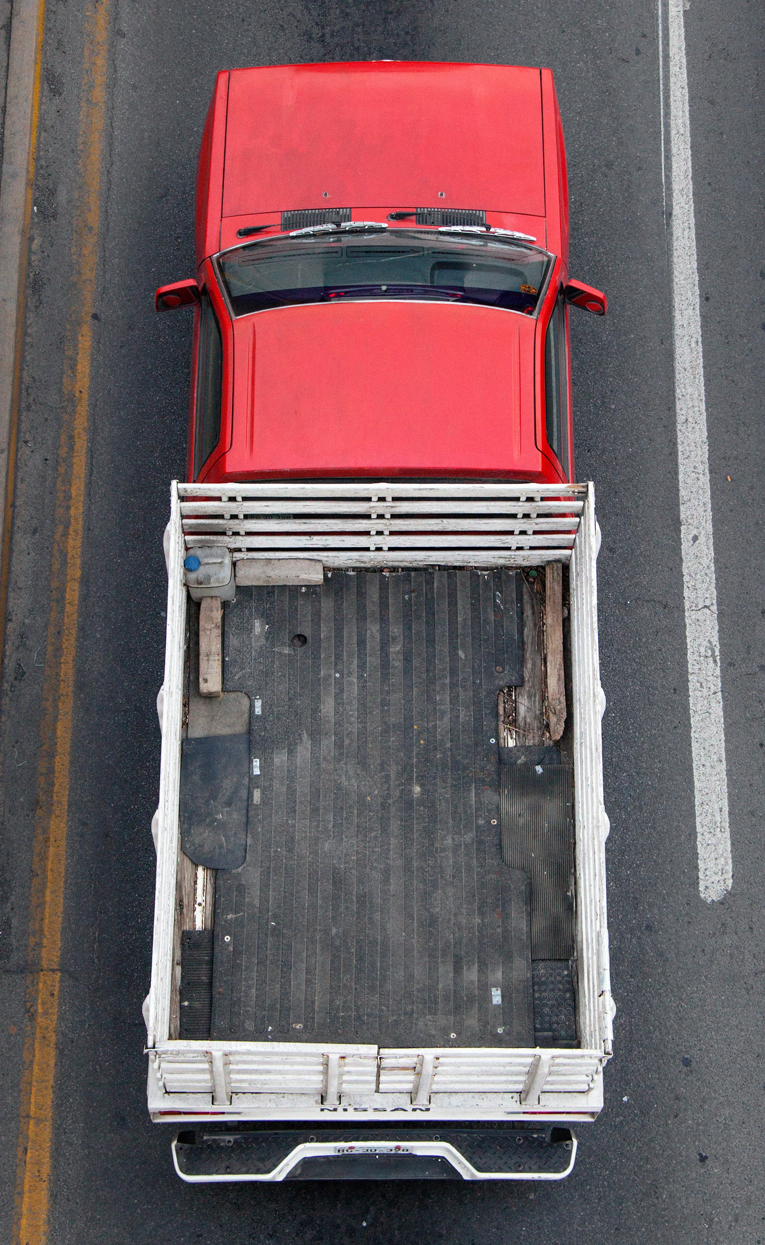 In Urban Transportation, Cartagena focuses on various modes of transportation used by workers in urban environments, particularly highlighting the ubiquitous red trucks. Shooting cars and trucks as they drive to work in the morning, Cartagena has been able to capture a stunning snapshot of what is the daily routine of a city. The colors and textures of the vehicles and objects, mixed with the contemporary idea of customizing vehicles make for arresting imagery of a contemporary Mexican city.