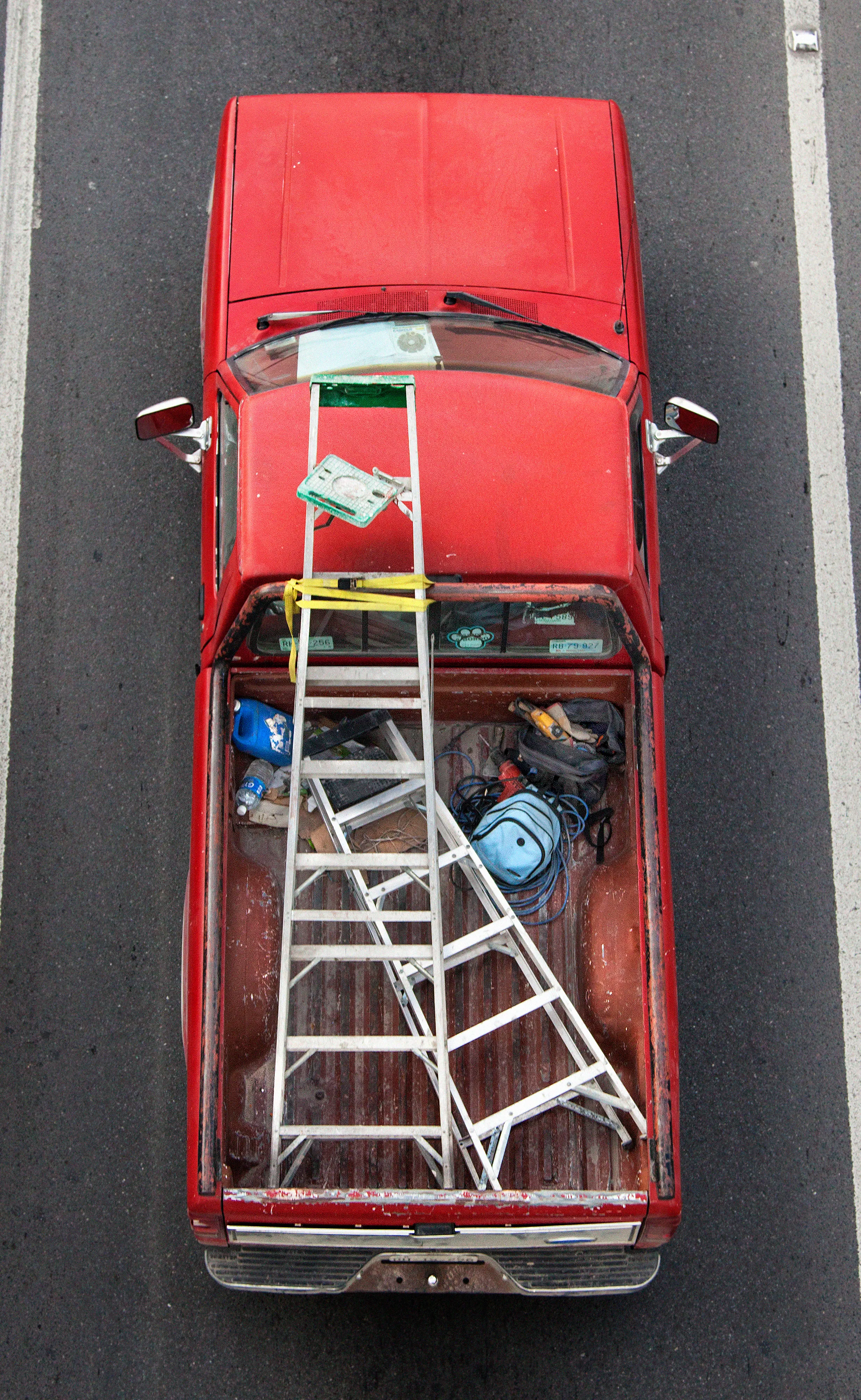 In Urban Transportation, Cartagena focuses on various modes of transportation used by workers in urban environments, particularly highlighting the ubiquitous red trucks. Shooting cars and trucks as they drive to work in the morning, Cartagena has been able to capture a stunning snapshot of what is the daily routine of a city. The colors and textures of the vehicles and objects, mixed with the contemporary idea of customizing vehicles make for arresting imagery of a contemporary Mexican city.