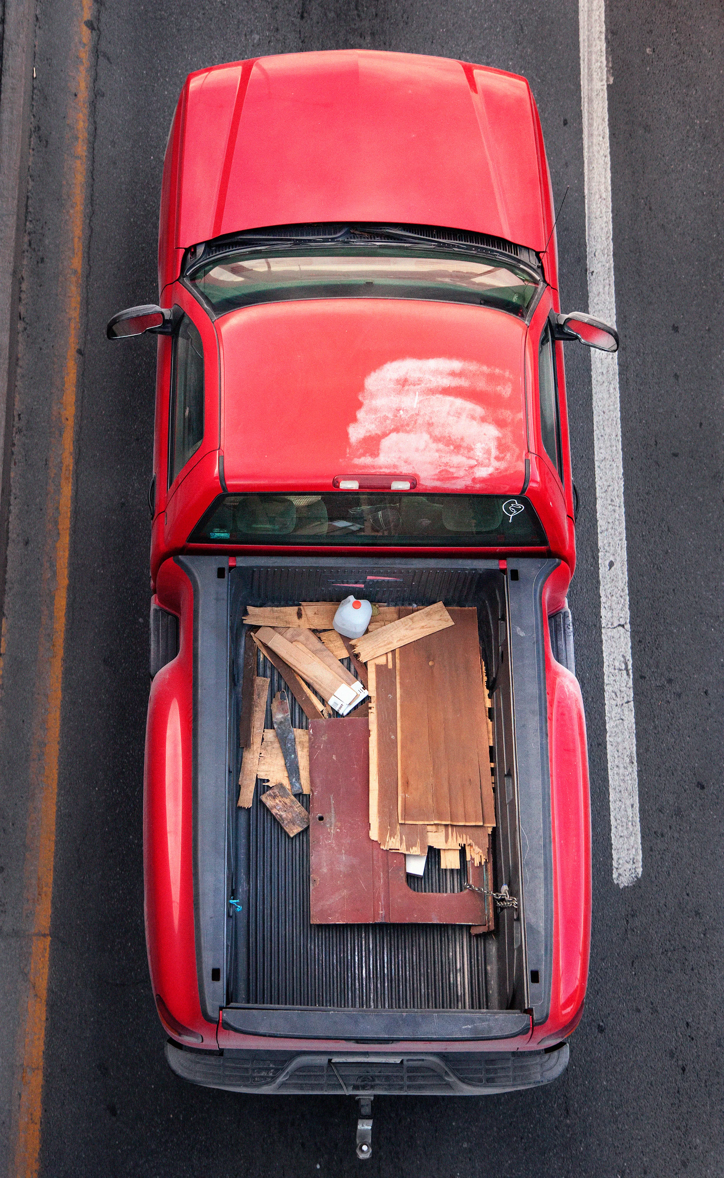 In Urban Transportation, Cartagena focuses on various modes of transportation used by workers in urban environments, particularly highlighting the ubiquitous red trucks. Shooting cars and trucks as they drive to work in the morning, Cartagena has been able to capture a stunning snapshot of what is the daily routine of a city. The colors and textures of the vehicles and objects, mixed with the contemporary idea of customizing vehicles make for arresting imagery of a contemporary Mexican city.