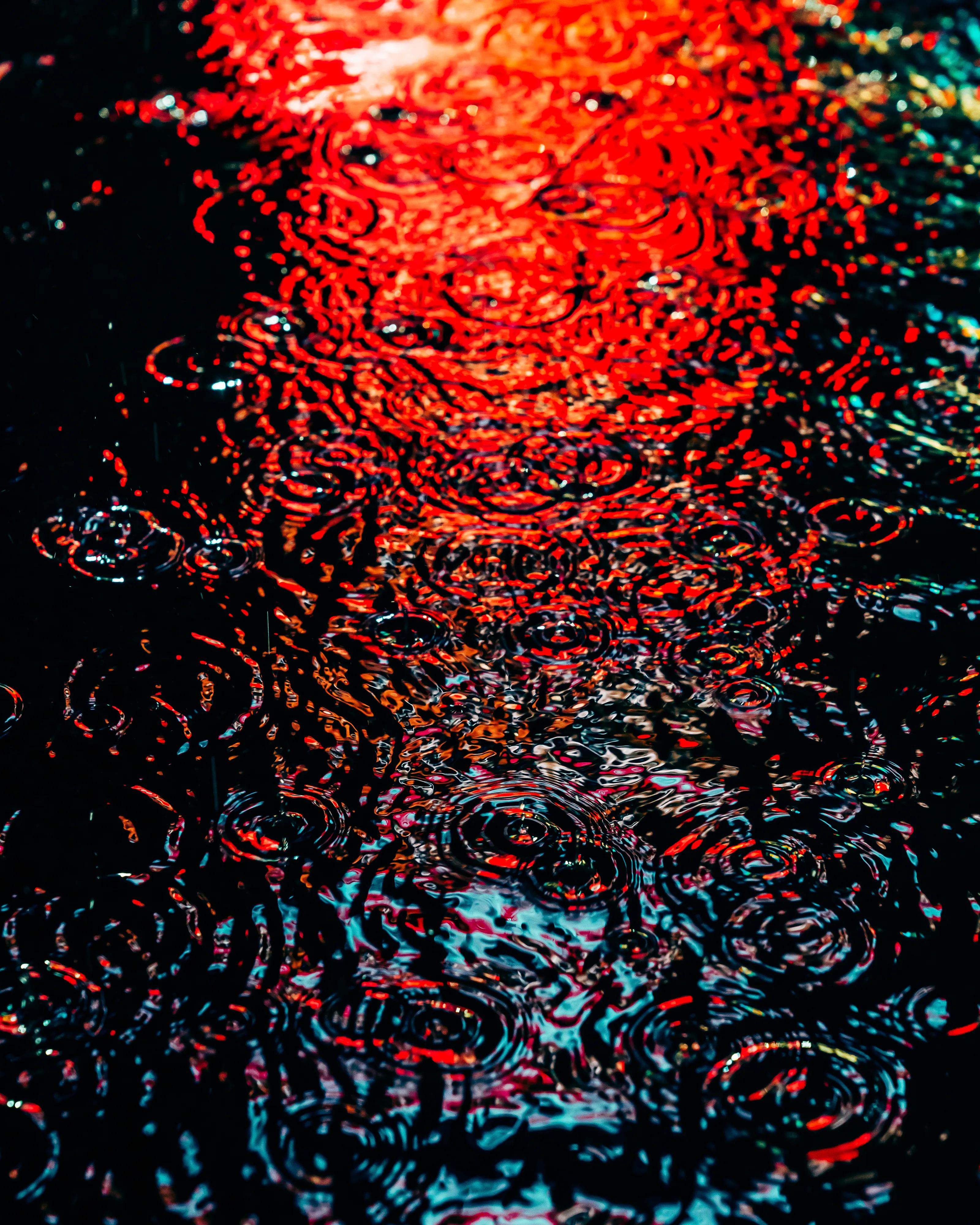 Drip Drop is an ode to the generative beauty of a universe unwinding. 1111 1/1 photographs of rain hitting puddles in Times Square, New York City. Rarity is determined by machine vision detecting a wide range of variables.