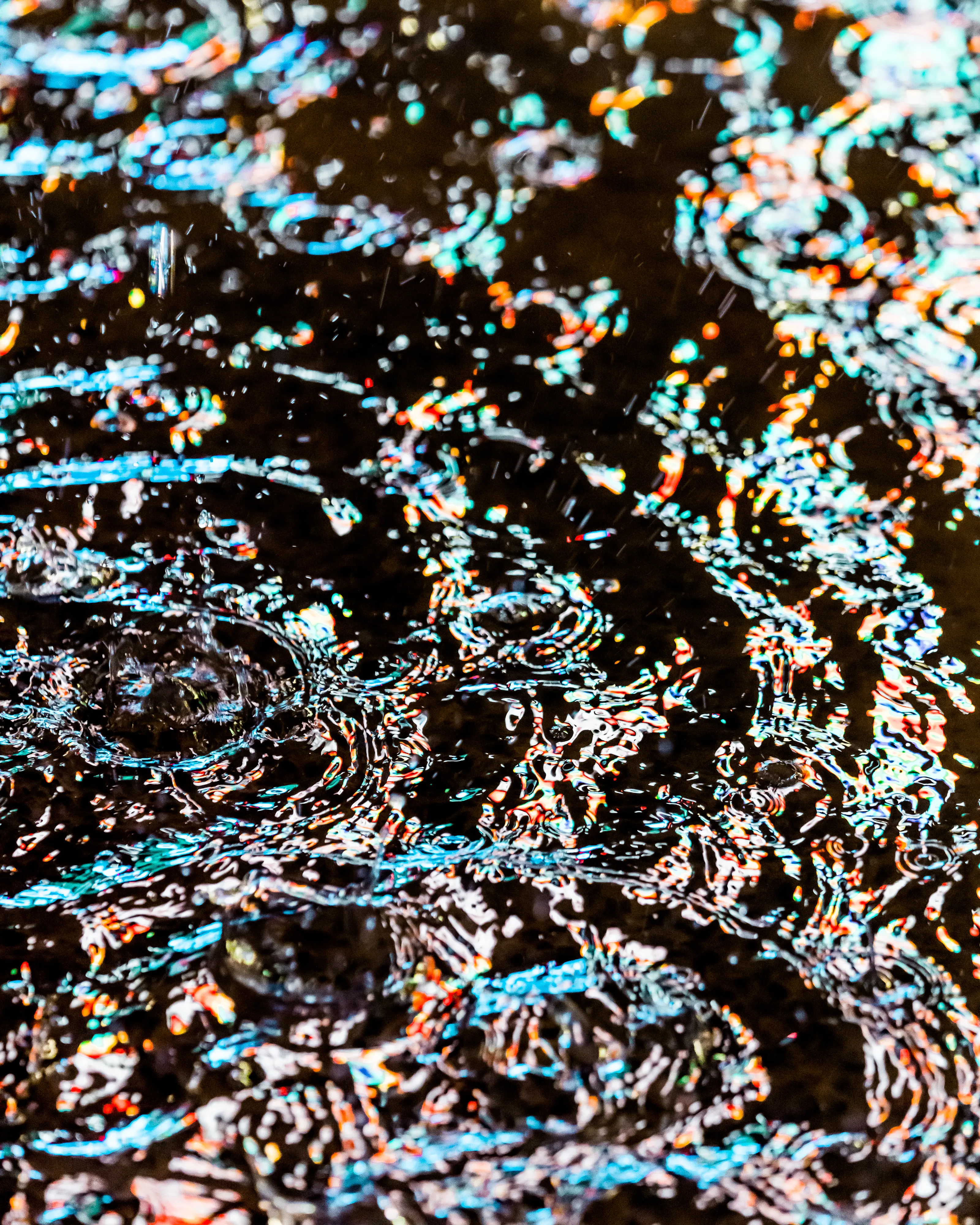 Drip Drop is an ode to the generative beauty of a universe unwinding. 1111 1/1 photographs of rain hitting puddles in Times Square, New York City. Rarity is determined by machine vision detecting a wide range of variables.