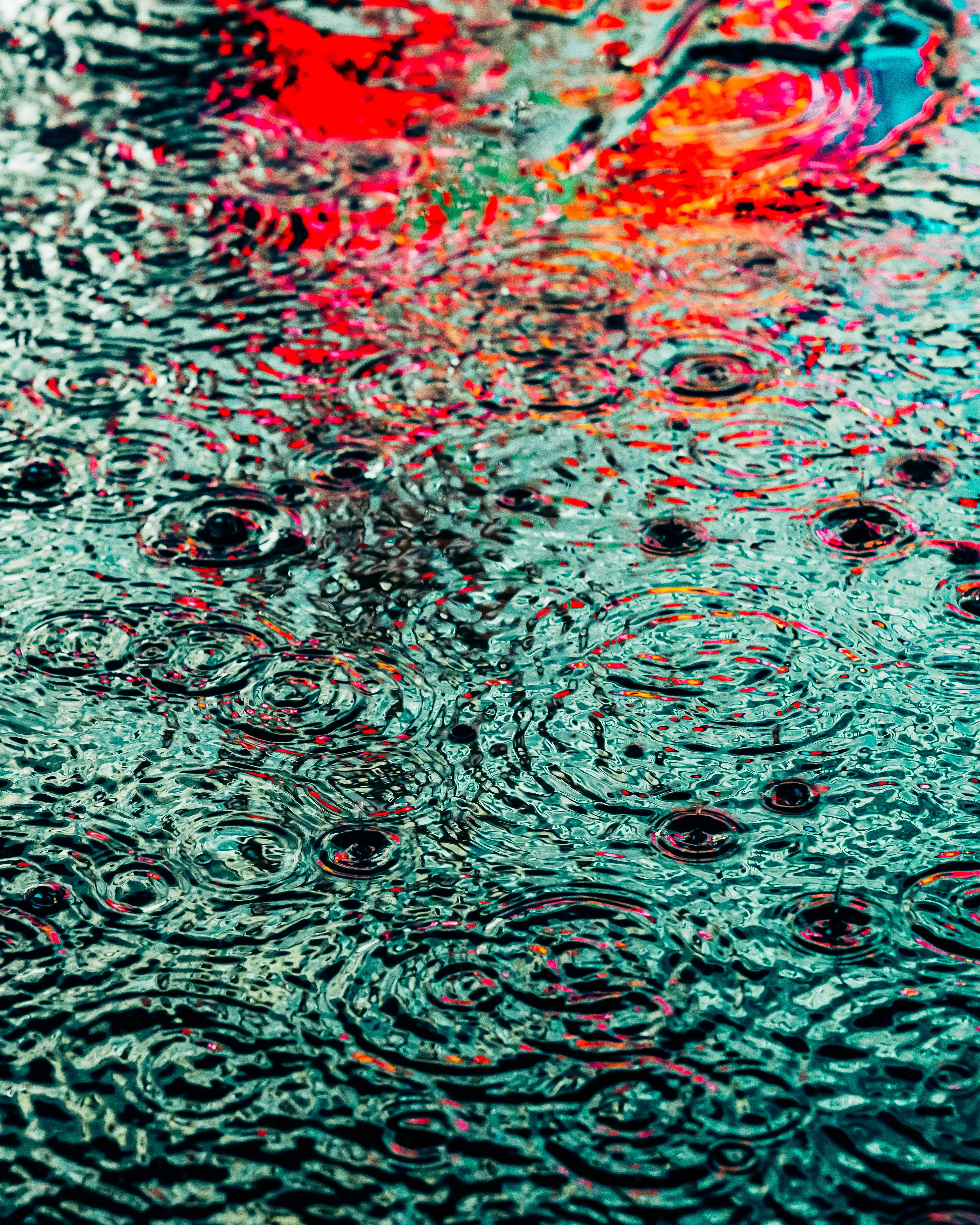 Drip Drop is an ode to the generative beauty of a universe unwinding. 1111 1/1 photographs of rain hitting puddles in Times Square, New York City. Rarity is determined by machine vision detecting a wide range of variables.