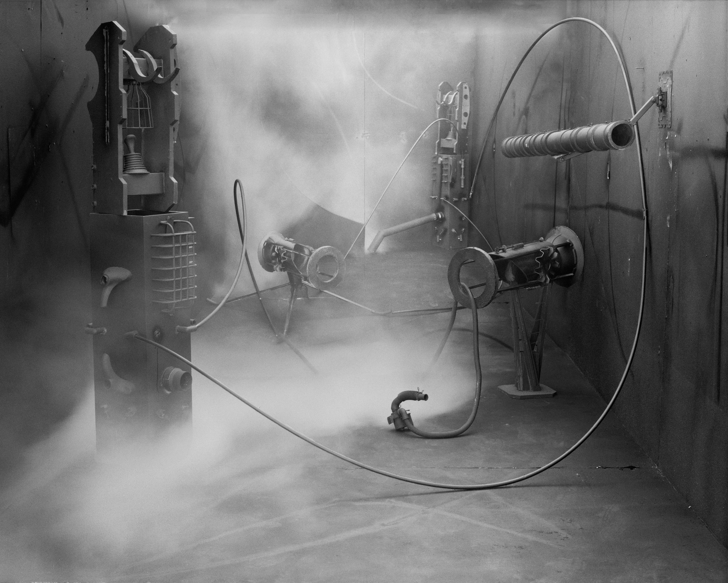 In conjunction with the exhibition in our physical gallery, Assembly presents “Afterwork” by Rodrigo Valenzuela. Based on the ghostly absence of workers in an indeterminate time and place, this work is at once futuristic and harking back to a century ago.

In staged sets suggesting abandoned factories, Valenzuela wishfully foments a revolution, enabling workers powerless in the face of relentless international movement of capital to flee or perhaps overrun their workplaces. As in a science-fiction universe where we feel a potential reality just out of reach of our present, Valenzuela’s scenes meld mechanical objects with steam or smoke, suggestive of steel manufacturing, a cloud of sweat-the only bodily proof of human toil-or a cinematic trope of futuristic atmosphere. In these eerily depopulated scenes, viewers are prompted to envision alternative possibilities to histories of workers dispossessed, or made obsolete, and industries that thrived on human pain.

Rodrigo Valenzuela is a Chilean-born, Los Angeles-based artist working in photography, video, painting, and installation. Not satisfied with the existing romanticism of blight and resurrection, Valenzuela opts for image making that is defiantly labor intensive and ambitious in scope. Detritus and industrial parts are scavenged over time, taken apart or reassembled, and transformed in the artist's own studio backdrops, then turned into flat images that confuse the viewer with scale shifts and multiple references. Using autobiographical threads to inform larger universal fields of experience, his work constructs narratives, scenes, and stories that point to the tensions found between the individual and communities. Much of his work deals with the experience of undocumented immigrants and laborers. His work has been exhibited internationally, including solo exhibitions at Lisa Kandlhofer Galerie, Vienna; the Ulrich Museum of Art, Wichita, KS; the Art Museum of the University of Memphis, TN; Klowdenmann Gallery, Los Angeles; the Frye Art Museum, Seattle; and Museo de Arte Contemporaneo, Santiago, Chile. In 2021, Valenuzlea was awarded a Guggenheim Fellowship in Photography and Smithsonian Artist Research Fellowship.