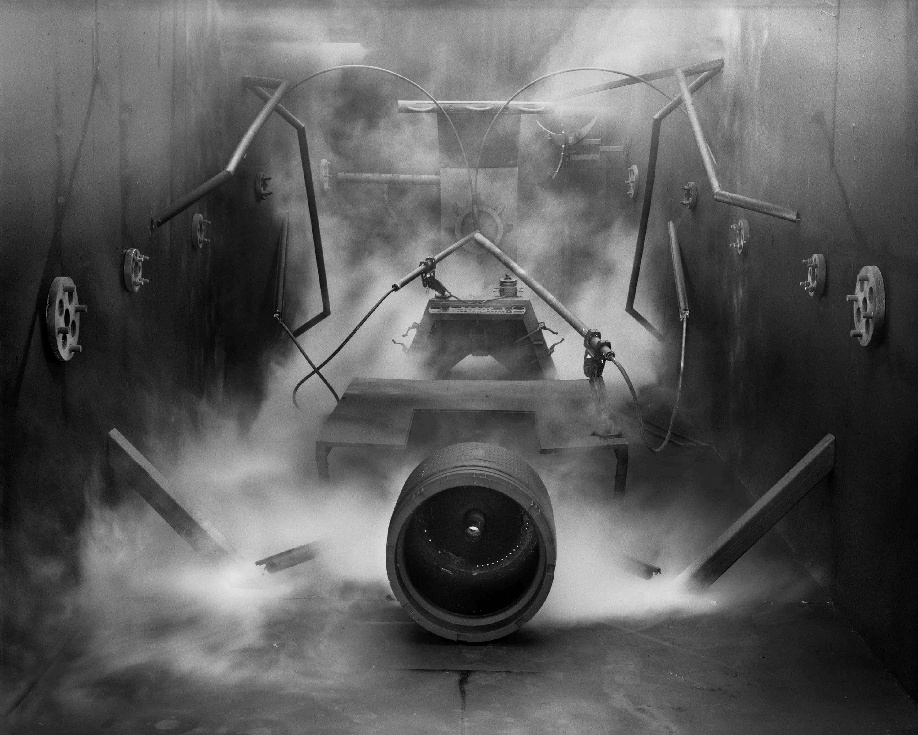In conjunction with the exhibition in our physical gallery, Assembly presents “Afterwork” by Rodrigo Valenzuela. Based on the ghostly absence of workers in an indeterminate time and place, this work is at once futuristic and harking back to a century ago.

In staged sets suggesting abandoned factories, Valenzuela wishfully foments a revolution, enabling workers powerless in the face of relentless international movement of capital to flee or perhaps overrun their workplaces. As in a science-fiction universe where we feel a potential reality just out of reach of our present, Valenzuela’s scenes meld mechanical objects with steam or smoke, suggestive of steel manufacturing, a cloud of sweat-the only bodily proof of human toil-or a cinematic trope of futuristic atmosphere. In these eerily depopulated scenes, viewers are prompted to envision alternative possibilities to histories of workers dispossessed, or made obsolete, and industries that thrived on human pain.

Rodrigo Valenzuela is a Chilean-born, Los Angeles-based artist working in photography, video, painting, and installation. Not satisfied with the existing romanticism of blight and resurrection, Valenzuela opts for image making that is defiantly labor intensive and ambitious in scope. Detritus and industrial parts are scavenged over time, taken apart or reassembled, and transformed in the artist's own studio backdrops, then turned into flat images that confuse the viewer with scale shifts and multiple references. Using autobiographical threads to inform larger universal fields of experience, his work constructs narratives, scenes, and stories that point to the tensions found between the individual and communities. Much of his work deals with the experience of undocumented immigrants and laborers. His work has been exhibited internationally, including solo exhibitions at Lisa Kandlhofer Galerie, Vienna; the Ulrich Museum of Art, Wichita, KS; the Art Museum of the University of Memphis, TN; Klowdenmann Gallery, Los Angeles; the Frye Art Museum, Seattle; and Museo de Arte Contemporaneo, Santiago, Chile. In 2021, Valenuzlea was awarded a Guggenheim Fellowship in Photography and Smithsonian Artist Research Fellowship.