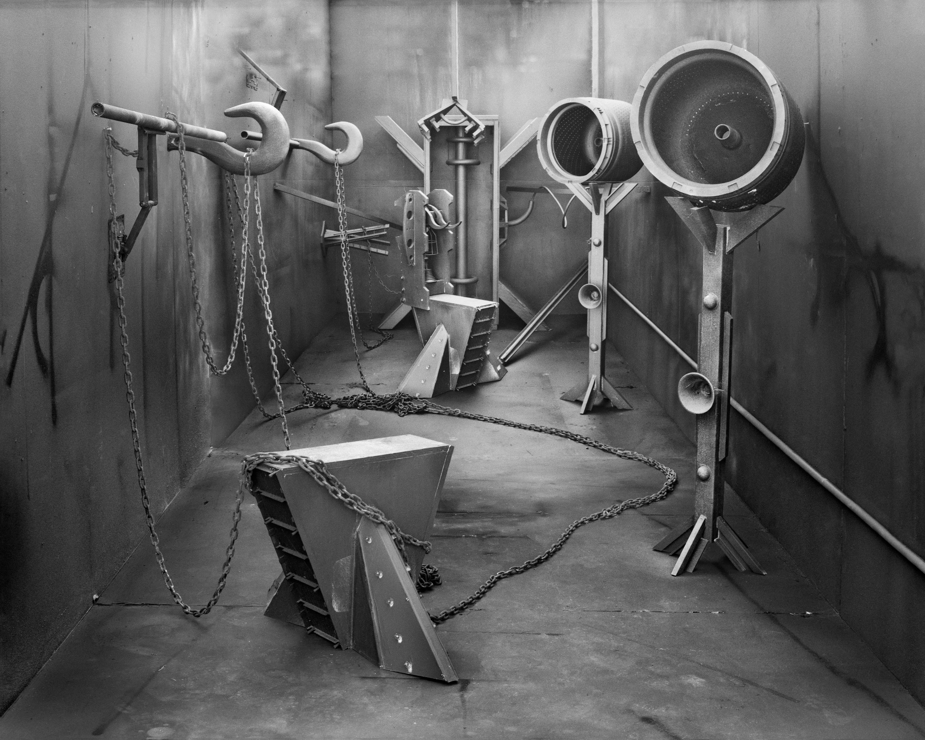 In conjunction with the exhibition in our physical gallery, Assembly presents “Afterwork” by Rodrigo Valenzuela. Based on the ghostly absence of workers in an indeterminate time and place, this work is at once futuristic and harking back to a century ago.

In staged sets suggesting abandoned factories, Valenzuela wishfully foments a revolution, enabling workers powerless in the face of relentless international movement of capital to flee or perhaps overrun their workplaces. As in a science-fiction universe where we feel a potential reality just out of reach of our present, Valenzuela’s scenes meld mechanical objects with steam or smoke, suggestive of steel manufacturing, a cloud of sweat-the only bodily proof of human toil-or a cinematic trope of futuristic atmosphere. In these eerily depopulated scenes, viewers are prompted to envision alternative possibilities to histories of workers dispossessed, or made obsolete, and industries that thrived on human pain.

Rodrigo Valenzuela is a Chilean-born, Los Angeles-based artist working in photography, video, painting, and installation. Not satisfied with the existing romanticism of blight and resurrection, Valenzuela opts for image making that is defiantly labor intensive and ambitious in scope. Detritus and industrial parts are scavenged over time, taken apart or reassembled, and transformed in the artist's own studio backdrops, then turned into flat images that confuse the viewer with scale shifts and multiple references. Using autobiographical threads to inform larger universal fields of experience, his work constructs narratives, scenes, and stories that point to the tensions found between the individual and communities. Much of his work deals with the experience of undocumented immigrants and laborers. His work has been exhibited internationally, including solo exhibitions at Lisa Kandlhofer Galerie, Vienna; the Ulrich Museum of Art, Wichita, KS; the Art Museum of the University of Memphis, TN; Klowdenmann Gallery, Los Angeles; the Frye Art Museum, Seattle; and Museo de Arte Contemporaneo, Santiago, Chile. In 2021, Valenuzlea was awarded a Guggenheim Fellowship in Photography and Smithsonian Artist Research Fellowship.
