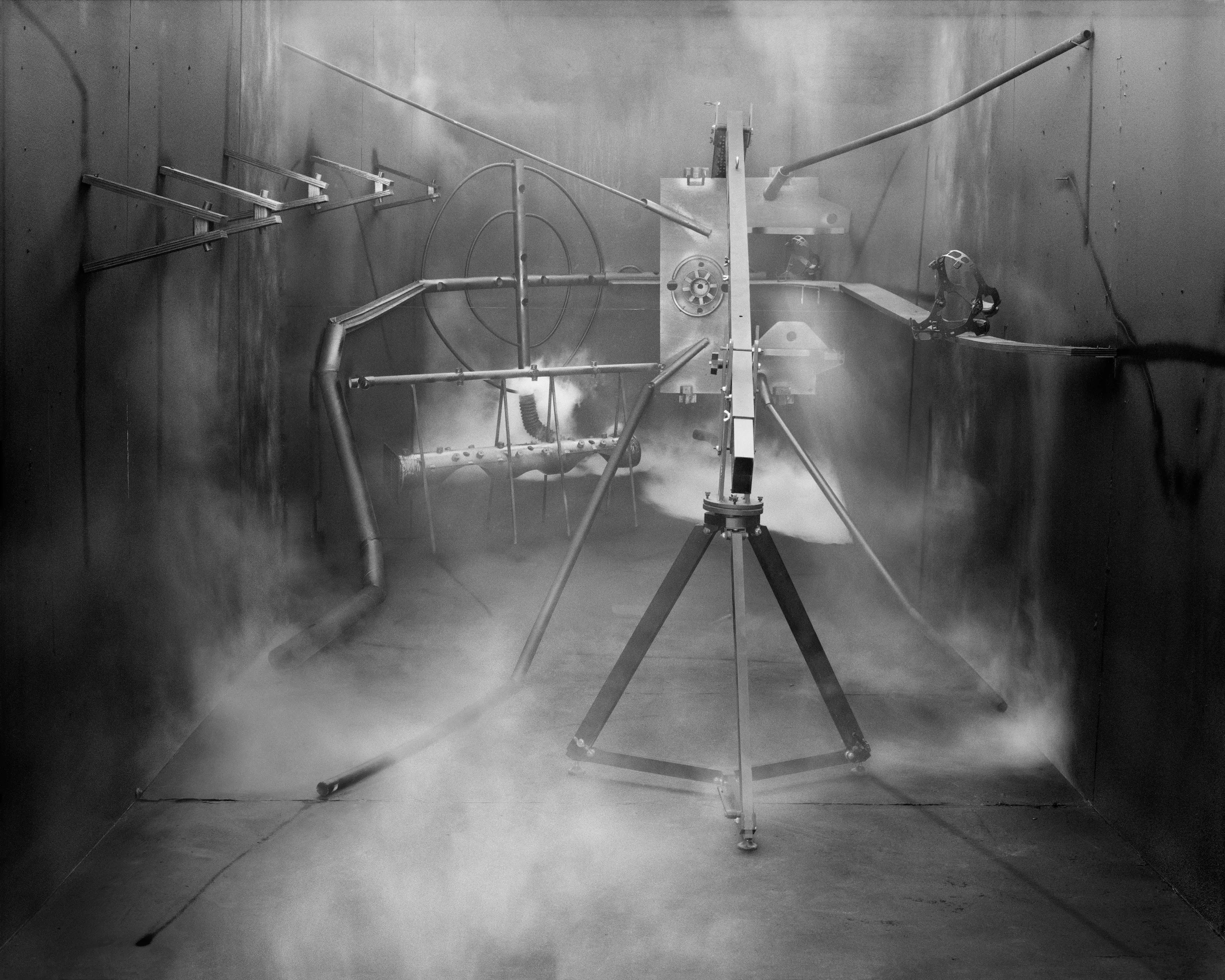 In conjunction with the exhibition in our physical gallery, Assembly presents “Afterwork” by Rodrigo Valenzuela. Based on the ghostly absence of workers in an indeterminate time and place, this work is at once futuristic and harking back to a century ago.

In staged sets suggesting abandoned factories, Valenzuela wishfully foments a revolution, enabling workers powerless in the face of relentless international movement of capital to flee or perhaps overrun their workplaces. As in a science-fiction universe where we feel a potential reality just out of reach of our present, Valenzuela’s scenes meld mechanical objects with steam or smoke, suggestive of steel manufacturing, a cloud of sweat-the only bodily proof of human toil-or a cinematic trope of futuristic atmosphere. In these eerily depopulated scenes, viewers are prompted to envision alternative possibilities to histories of workers dispossessed, or made obsolete, and industries that thrived on human pain.

Rodrigo Valenzuela is a Chilean-born, Los Angeles-based artist working in photography, video, painting, and installation. Not satisfied with the existing romanticism of blight and resurrection, Valenzuela opts for image making that is defiantly labor intensive and ambitious in scope. Detritus and industrial parts are scavenged over time, taken apart or reassembled, and transformed in the artist's own studio backdrops, then turned into flat images that confuse the viewer with scale shifts and multiple references. Using autobiographical threads to inform larger universal fields of experience, his work constructs narratives, scenes, and stories that point to the tensions found between the individual and communities. Much of his work deals with the experience of undocumented immigrants and laborers. His work has been exhibited internationally, including solo exhibitions at Lisa Kandlhofer Galerie, Vienna; the Ulrich Museum of Art, Wichita, KS; the Art Museum of the University of Memphis, TN; Klowdenmann Gallery, Los Angeles; the Frye Art Museum, Seattle; and Museo de Arte Contemporaneo, Santiago, Chile. In 2021, Valenuzlea was awarded a Guggenheim Fellowship in Photography and Smithsonian Artist Research Fellowship.