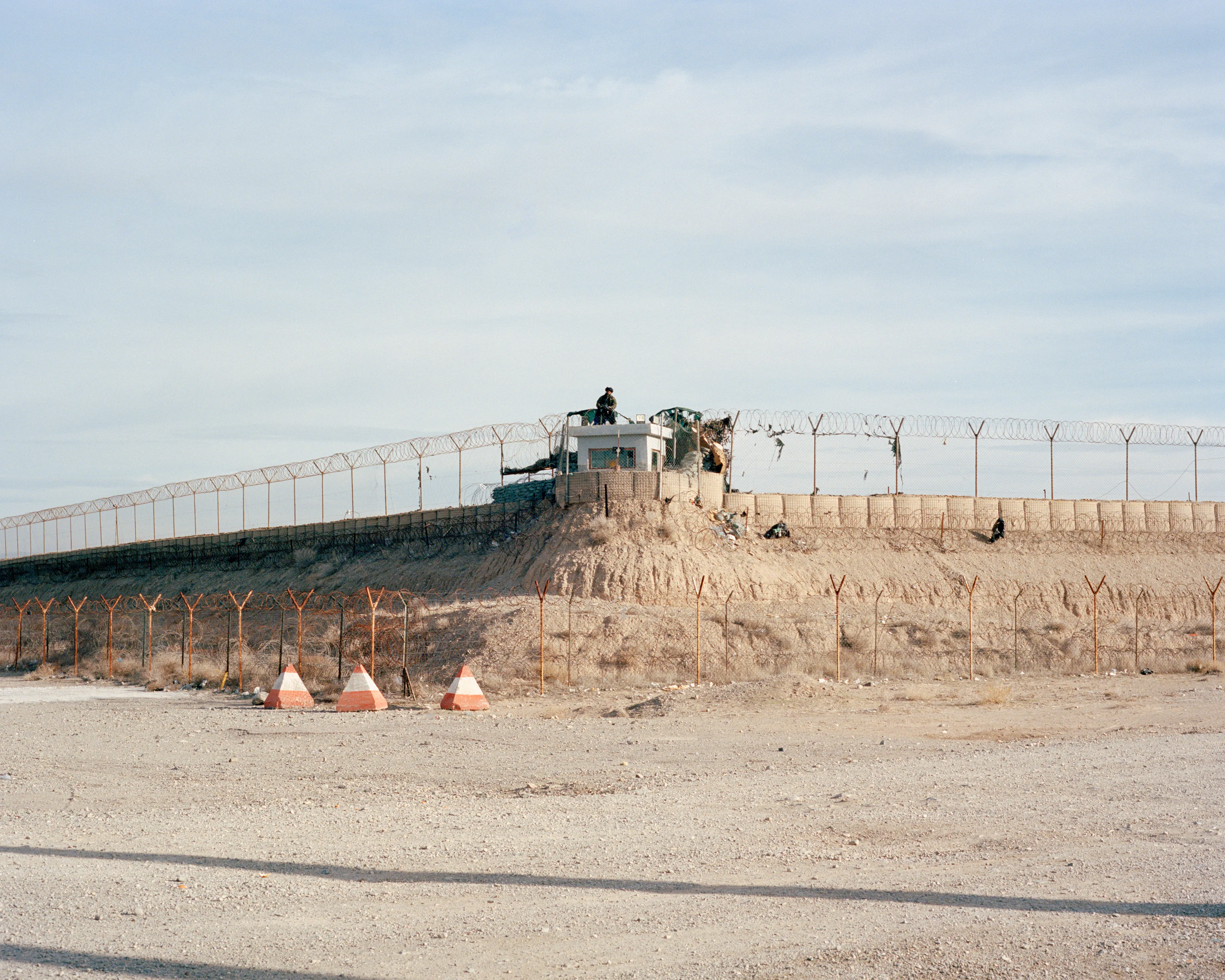 The Kabuler #30 by Lorenzo Meloni

AFGHANISTAN. Herat. January 2022.  A watchtower with a Taliban fighter guarding the former NATO/ISAF military base at Camp Arena, which once hosted the US, Italian and Spanish armies.

Afghanistan has been one of the most documented regions in the world for the last two decades, yet it remains a big mystery for the general audience who finds it hard to grasp the complete picture behind the constant reporting of breaking news.

This collection of 55 NFT is the first part of “The Kabuler” project, in which Lorenzo Meloni partners with Cristina de Middel to produce a full panoramic photograph of the current situation of the country, borrowing the treatment that the media provide to other destinations and topics that are not under constant scrutiny. 

The project will use the sections of a traditional magazine to propose a complete overview of Afghanistan with an editorial structure, that should prevent the audience from falling again into dramatic expectations.

Edition: 1 of 1

Commissioned by Obscura