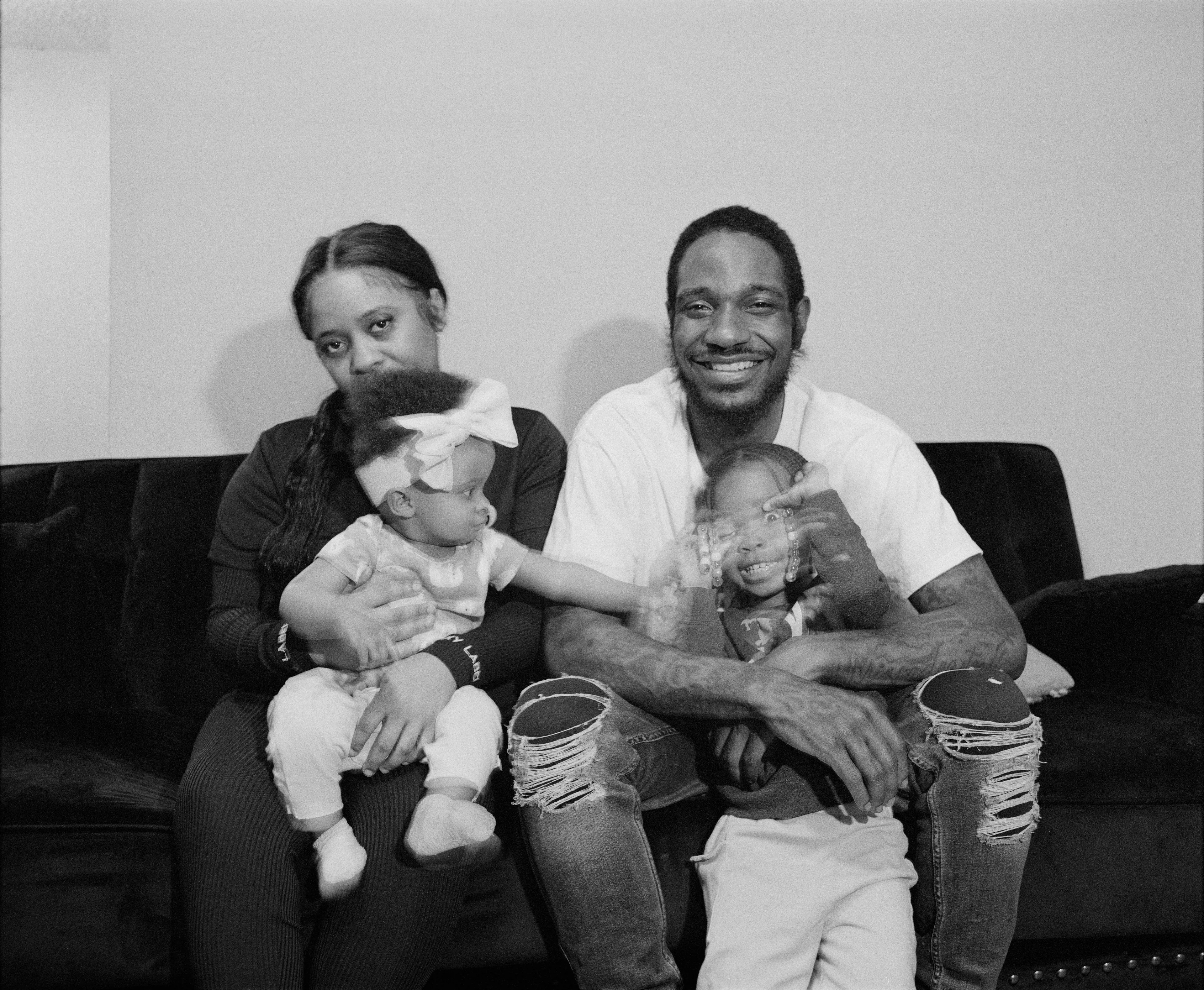 It's Expensive to be Poor #10 Bob, Jasmin & Family by Hannah Price

I wanted to create a project on the costs of being poor. About how the U.S. system and bills keep the poor behind and dig a deeper hole in their life. In my research, I found a single mother of 32 years being neglected by affordable housing: Lisa McKine.

I first saw Lisa on a Philly Instagram page called nogunzone; it reposts police news and share reports from people in the community. I find it more informative than the local news, however I know several people who choose not to tune in for mental health reasons; it shows all the bad and we are currently on track to outdo last year’s homicide rate. 

Days after a tragic fire in another Philadelphia affordable housing apartment (PHA) that killed 12 people, a social media trend began with videos of people sharing themselves holding burning cigarettes near a silent smoke alarm. One in particular caught my eye, Lisa’s video of her son, telling him to wake up as a bunch of flies flew off his face.

Lisa did not grow up poor, she was raised by her dad and stepmother. Her dad worked for Philly managing janitorial duties in the courthouse. Her parents separated when she was young and it wasn’t until her 20’s when she learned bad habits from her biological mother of working the system. Lisa found herself a single mother of 2 and living in her first apartment of PHA affordable housing for ten years.

Lisa’s brother, Raul Gore (Bobby, 27) is currently on probation and has dealt with his own circumstances. He told me about the decisions he made in his early twenties that put him in and out of jail. He knows he can’t change how irresponsible he was but is now enjoying life with his family and providing for them. He works during the week and his wife on the weekends, they take turns watching their children. The environment Bobby grew up in at a younger age was surrounded by cops who watched him and his friends go to and from school. He remembers having fun with the cops by making them chase him and his friends. 

My first visit to Lisa’s place was at the beginning of March. There was an exterminator outside her building with hoses hooked up to an apartment on the second floor. Inside her apartment I noticed a particular odor and counted at least two roaches and one dead in the kitchen cabinet. Lisa had been complaining about the roach infestation to PHA since 2020, sharing records of failed exterminations and the summer of 2021 is when the flies started. The infestation has forced her to live out of bins and plastic bags. PHA exterminates the apartment every month and denies Lisa from moving to a new place. 

While photographing Lisa, I learned she has an associate in Applied Science in Construction Management from the college I work at. We crossed paths in 2018 but never met each other. Sharing personal frustrations, we spent a lot of time together as we both needed someone to just hear us and provide emotional support. Her boys Zaahir (11) and Quamir (5) are well behaved, social and sweet. Lisa provides for them all by driving Uber, bartering with her community, making and selling her own hair and skin products, as well as providing different hair services and body contouring.  

Luckily, Lisa found help to make a few months' deposit on rent for a new house outside of affordable housing. Through her 4 businesses, she plans to cover her rent of $2500. Lisa’s new house windows will help with her mood and knowing her dad is 13 minutes away in a nursing home should relieve some stress. Lisa’s dad had a stroke, causing bleeding in the brain which forced him to remove the left side of his brain. Her step mother also had brain surgery due to a horrible fall, and now both her parents are bed ridden while they recover from surgery.

Witnessing Lisa’s life, I imagined myself in her situation. A single mother unhappy in an infested home, barely getting by where the only way out is taking a huge risk renting a house not knowing she can afford it. The point of this NFT is to give back to the community, specifically Lisa so I have shared Lisa’s wallet address with you below.

The more time I spent with Lisa, the closer we became. We talked about dating and tried to provide emotional support for each other’s lives. I don’t become friends with all my subjects, but those who don’t have a problem expressing and sharing their feelings, I tend to share back. One day, I couldn’t help but break down crying and another day Lisa needed to as well. It was when we had planned to take the photograph in the window from the outside perspective that she was telling me how her dad was transferred to a different hospital. Wondering why, she demanded to see him and discovered he had a large infected bed sore that went up his back. From the photo, the scab looked at least 2’ long and 1’ wide with a fist sized faint sore. Why did they wait so long to tell Lisa? More neglect. Lisa would love to take care of him herself if she had known. In the end, Lisa still wanted to make the photograph, she wanted to keep her promise and help me with my project. I said no, but ultimately gave in even though it was completely dark out. My plan was to catch the sun setting. However, life isn’t what we plan it to be. During the photo, I could hear Lisa praying to God and her ancestors, full of sadness, hope and joy. 

To keep up with Lisa, follow her on Instagram @lovelylisa215, @hollywoodglamour.co, @mckine_building_group

Donate ether to Lisa’s address:  0x0cE11858dc7f01E6c2bEB9d1f2F6cb273484076e

Edition: 1 of 1

Commissioned by Obscura