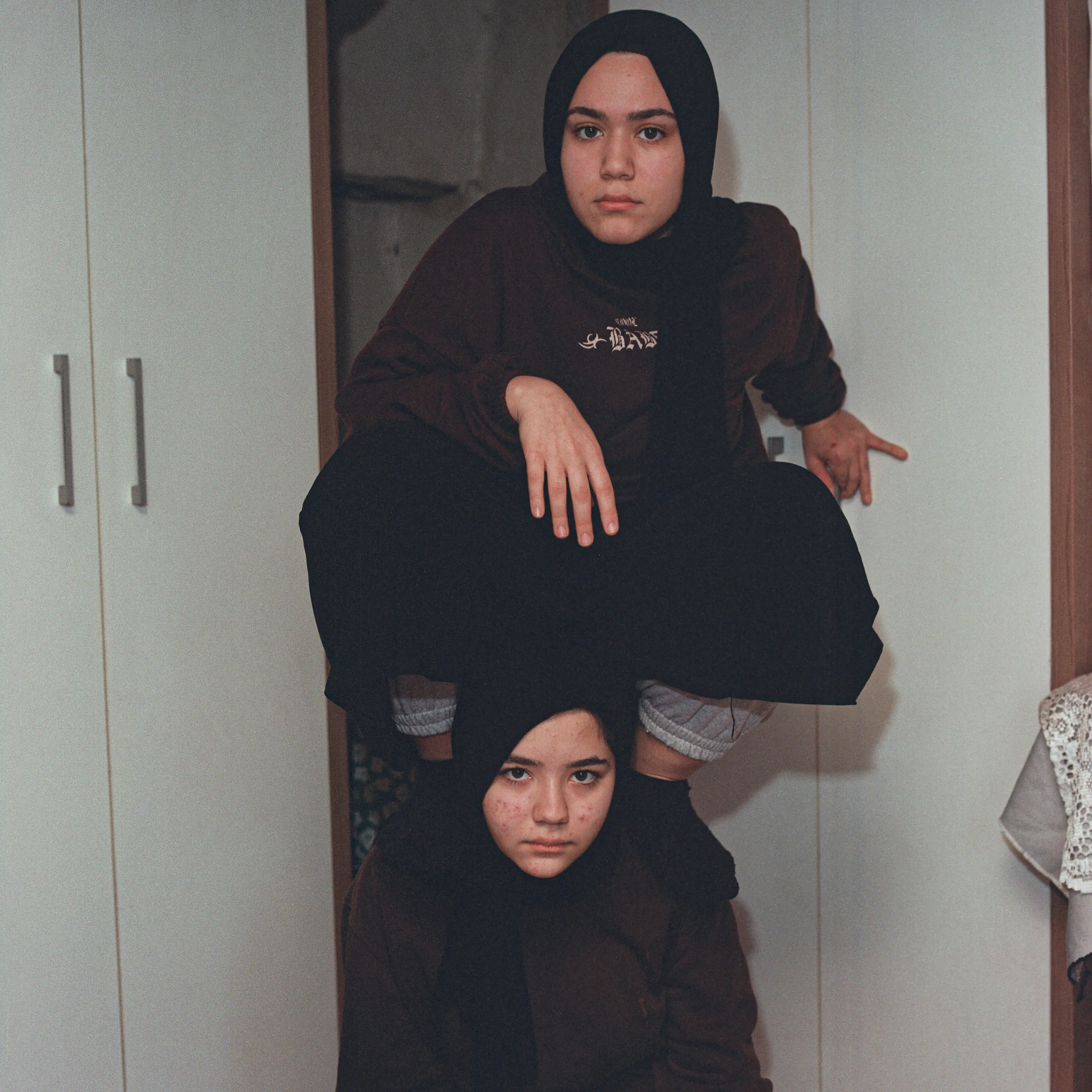 Transfiguration #21 by Sabiha Çimen

Şevval and Zeze sisters. Istanbul, Turkey.

The impetus of this project grew out of my first book Hafız, about young girls who are memorizing Quran in schools through-out Turkey. Some marry and have children soon after graduation, but some rebel and transform themselves in a radical way; Şeyma is one of those stories of Transfiguration.

This is a world known to me because I too studied in a Quran school with my twin sister in Istanbul when I was younger.  When I returned to do my first long term photographic project l sought out familiar scenes and objects from my memory there and it was there that I met Şeyma and her unique and radical ways.

My projects usually deal with the Art of Resistance within my close circle of friends and family. In my last project the young girls' trivialities and playfulness took center stage, and now as these girls enter into adulthood they are faced with living in a world of male dominance. Sometimes, as with Şeyma, there is a need for revenge with their new found power over men and their money and habits; an inner strength coming from raw female intellect, and sexuality. 

This time my project not only focuses on the girls stories, but lies within the context of a large city- Istanbul, with its multiple layers and meanings. l am trying to provide the viewer cause and effect by viewing the different strata simultaneously and between. In the story Şeyma l am portraying her world, her fantasies, her fears, hidden love stories, songs and signs, ancient traditions, religious black-outs, and her continued spirituality that was never lost even through her Transfiguration. 


Edition: 1 of 1

Commissioned by Obscura