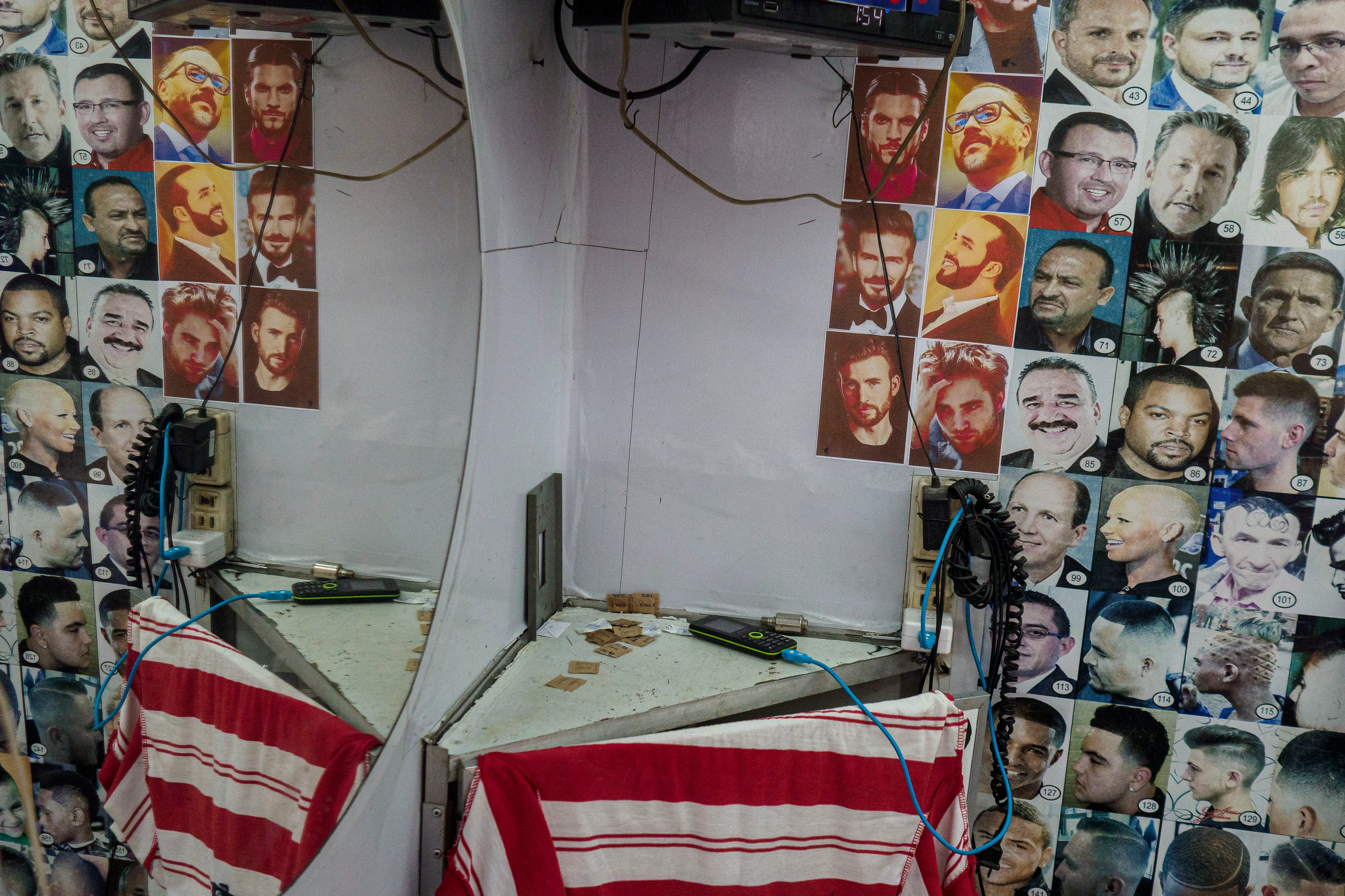 « Bitcoin Nation » #13 by Thomas Dworzak

EL SALVADOR, San Salvador, 2022/3-4. Downtown. Hairdresser. President Nayib Bukele (3rd and 6th from left in 3rd row).

« Bitcoin Nation » - El Salvador - Thomas Dworzak / Magnum Photos

Many photographers and journalists of my generation, interested in war and conflict, would at one point read Richard Kapusciznsky's all-time classic "The Soccer War" and watch Oliver Stone's "Salvador. » The latternow feels insanely cheesy. With the country's troubled history in mind and never having been to Central America, I found "Bitcoin Nation - El Salvador" a challenging theme to explore for this NFT project. 

I set out to straightforwardly document this alien and invisible world of bitcoin, and being 'in the realm of crypto,' I hoped it would give me access to President Nayib Bukele's surprise project. Last year he had suddenly declared Bitcoin the official currency of El Salvador - which until now was only the US dollar. The 40-year-old president of Palestinian origin started out as an anti-establishment candidate, describing himself as "the world's coolest dictator," but soon took an authoritarian turn. Yet he continues drumming the bitcoin beat, and bitcoin celebrities from all around the world keep flocking to El Salvador.
The Pacific beach town of El Zonte became "Bitcoin Beach," and "Volcano Bonds" and "Bitcoin City" are meant to be the future.

When official doors remained closed for me, I started digging for clues in the county's troubled past and present or anything, even remotely, related to the bitcoin world. Vignettes of the bloody civil war regularly popped up, and I came across a few "bitcoin events." The sudden spike of almost a hundred homicides in the course of one weekend in late March, due to what seemed a breakdown of a secret deal between the government and the two main gangs, had President Bukele declare a state of emergency, martial law and intensify the war on the gangs. I could see fringes of it. But nothing compared to the brutality of
the spectacularly filmed daily government propaganda videos of mass arrests and more-than-rough prisoner handlings I watched on TV, Twitter, and Instagram.

It was at a small bitcoin event that I found a hint why I may have been shunned and didn't get any access to show the "shiny world of Bitcoin Nation," as I had hoped. My NFT ticket was definitely the "wrong church" in the Bitcoin world. To paraphrase one of the speakers: "If I want to gamble, I go to Vegas and party with beautiful hookers, instead of being a loser, sitting around in my basement, frustrated, minting NFTs. Shitcoins."

El Salvador and the President were meant to be guests of honor at the Bitcoin 2022 conference in Miami. But due to the internal tension, he canceled the visit, and the 30+ thousand delegates had to discuss the future of bitcoin without him.

Edition: 1 of 1

Commissioned by Obscura