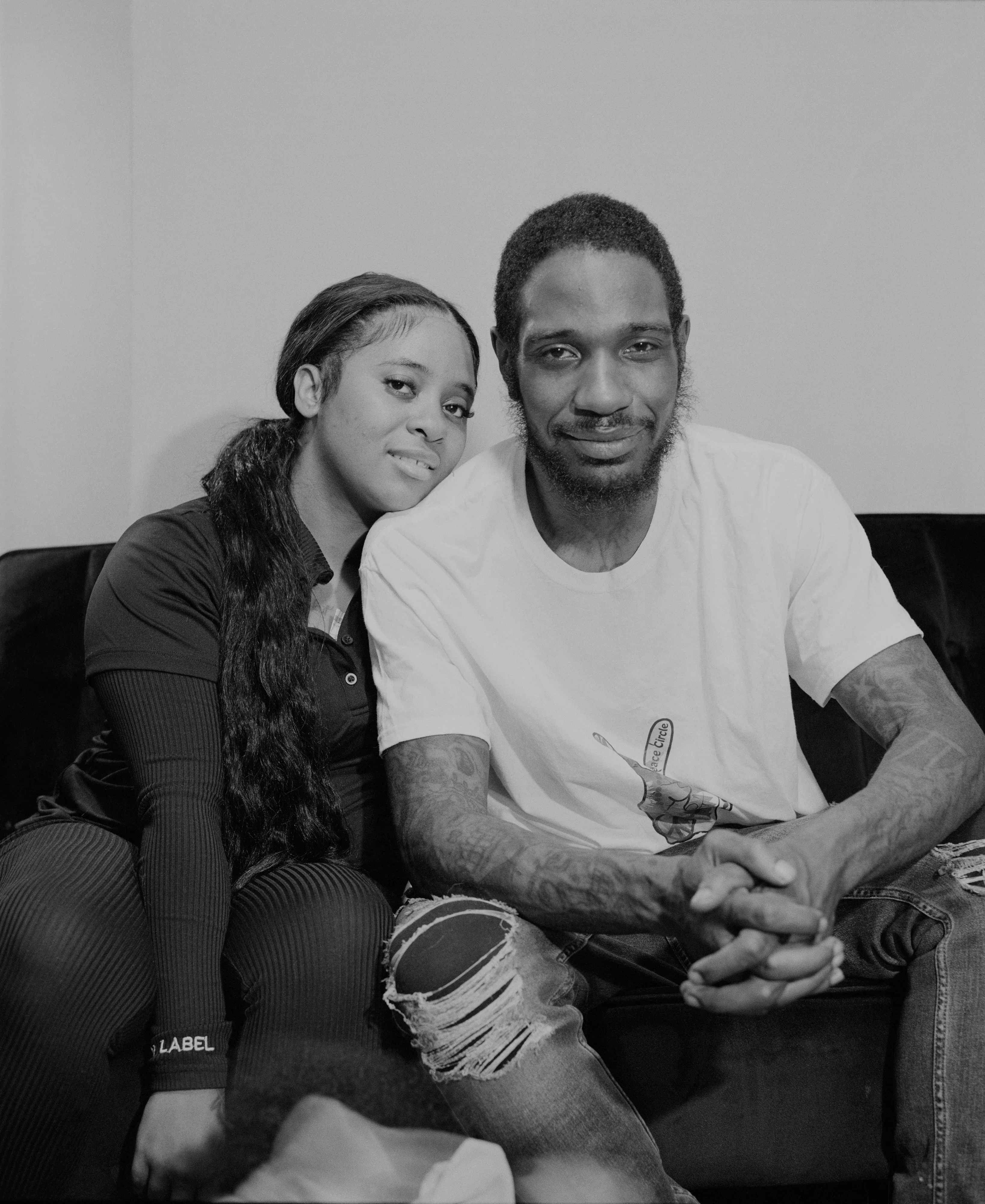 It's Expensive to be Poor #6 Bob & Jasmin by Hannah Price

I wanted to create a project on the costs of being poor. About how the U.S. system and bills keep the poor behind and dig a deeper hole in their life. In my research, I found a single mother of 32 years being neglected by affordable housing: Lisa McKine.

I first saw Lisa on a Philly Instagram page called nogunzone; it reposts police news and share reports from people in the community. I find it more informative than the local news, however I know several people who choose not to tune in for mental health reasons; it shows all the bad and we are currently on track to outdo last year’s homicide rate. 

Days after a tragic fire in another Philadelphia affordable housing apartment (PHA) that killed 12 people, a social media trend began with videos of people sharing themselves holding burning cigarettes near a silent smoke alarm. One in particular caught my eye, Lisa’s video of her son, telling him to wake up as a bunch of flies flew off his face.

Lisa did not grow up poor, she was raised by her dad and stepmother. Her dad worked for Philly managing janitorial duties in the courthouse. Her parents separated when she was young and it wasn’t until her 20’s when she learned bad habits from her biological mother of working the system. Lisa found herself a single mother of 2 and living in her first apartment of PHA affordable housing for ten years.

Lisa’s brother, Raul Gore (Bobby, 27) is currently on probation and has dealt with his own circumstances. He told me about the decisions he made in his early twenties that put him in and out of jail. He knows he can’t change how irresponsible he was but is now enjoying life with his family and providing for them. He works during the week and his wife on the weekends, they take turns watching their children. The environment Bobby grew up in at a younger age was surrounded by cops who watched him and his friends go to and from school. He remembers having fun with the cops by making them chase him and his friends. 

My first visit to Lisa’s place was at the beginning of March. There was an exterminator outside her building with hoses hooked up to an apartment on the second floor. Inside her apartment I noticed a particular odor and counted at least two roaches and one dead in the kitchen cabinet. Lisa had been complaining about the roach infestation to PHA since 2020, sharing records of failed exterminations and the summer of 2021 is when the flies started. The infestation has forced her to live out of bins and plastic bags. PHA exterminates the apartment every month and denies Lisa from moving to a new place. 

While photographing Lisa, I learned she has an associate in Applied Science in Construction Management from the college I work at. We crossed paths in 2018 but never met each other. Sharing personal frustrations, we spent a lot of time together as we both needed someone to just hear us and provide emotional support. Her boys Zaahir (11) and Quamir (5) are well behaved, social and sweet. Lisa provides for them all by driving Uber, bartering with her community, making and selling her own hair and skin products, as well as providing different hair services and body contouring.  

Luckily, Lisa found help to make a few months' deposit on rent for a new house outside of affordable housing. Through her 4 businesses, she plans to cover her rent of $2500. Lisa’s new house windows will help with her mood and knowing her dad is 13 minutes away in a nursing home should relieve some stress. Lisa’s dad had a stroke, causing bleeding in the brain which forced him to remove the left side of his brain. Her step mother also had brain surgery due to a horrible fall, and now both her parents are bed ridden while they recover from surgery.

Witnessing Lisa’s life, I imagined myself in her situation. A single mother unhappy in an infested home, barely getting by where the only way out is taking a huge risk renting a house not knowing she can afford it. The point of this NFT is to give back to the community, specifically Lisa so I have shared Lisa’s wallet address with you below.

The more time I spent with Lisa, the closer we became. We talked about dating and tried to provide emotional support for each other’s lives. I don’t become friends with all my subjects, but those who don’t have a problem expressing and sharing their feelings, I tend to share back. One day, I couldn’t help but break down crying and another day Lisa needed to as well. It was when we had planned to take the photograph in the window from the outside perspective that she was telling me how her dad was transferred to a different hospital. Wondering why, she demanded to see him and discovered he had a large infected bed sore that went up his back. From the photo, the scab looked at least 2’ long and 1’ wide with a fist sized faint sore. Why did they wait so long to tell Lisa? More neglect. Lisa would love to take care of him herself if she had known. In the end, Lisa still wanted to make the photograph, she wanted to keep her promise and help me with my project. I said no, but ultimately gave in even though it was completely dark out. My plan was to catch the sun setting. However, life isn’t what we plan it to be. During the photo, I could hear Lisa praying to God and her ancestors, full of sadness, hope and joy. 

To keep up with Lisa, follow her on Instagram @lovelylisa215, @hollywoodglamour.co, @mckine_building_group

Donate ether to Lisa’s address:  0x0cE11858dc7f01E6c2bEB9d1f2F6cb273484076e

Edition: 1 of 1

Commissioned by Obscura