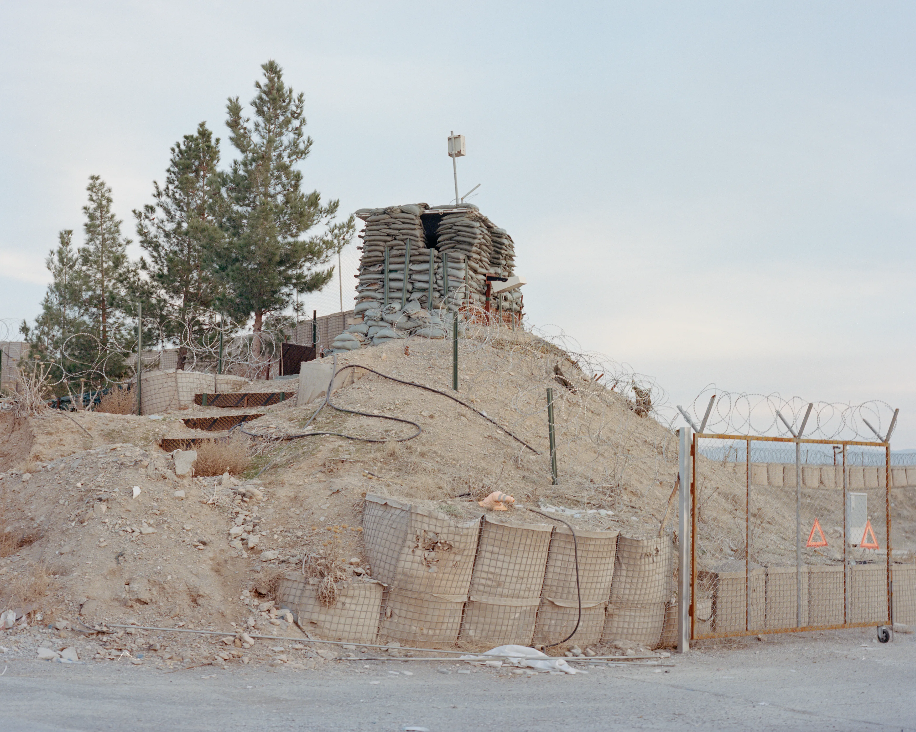 The Kabuler #4 by Lorenzo Meloni


AFGHANISTAN. Herat. January 2022.  A watchtower inside the Camp arena base, a military base once occupied by the US, Italian and Spanish armies and now recaptured by the Taliban.

Afghanistan has been one of the most documented regions in the world for the last two decades, yet it remains a big mystery for the general audience who finds it hard to grasp the complete picture behind the constant reporting of breaking news.

This collection of 55 NFT is the first part of “The Kabuler” project, in which Lorenzo Meloni partners with Cristina de Middel to produce a full panoramic photograph of the current situation of the country, borrowing the treatment that the media provide to other destinations and topics that are not under constant scrutiny. 

The project will use the sections of a traditional magazine to propose a complete overview of Afghanistan with an editorial structure, that should prevent the audience from falling again into dramatic expectations.

Edition: 1 of 1

Commissioned by Obscura