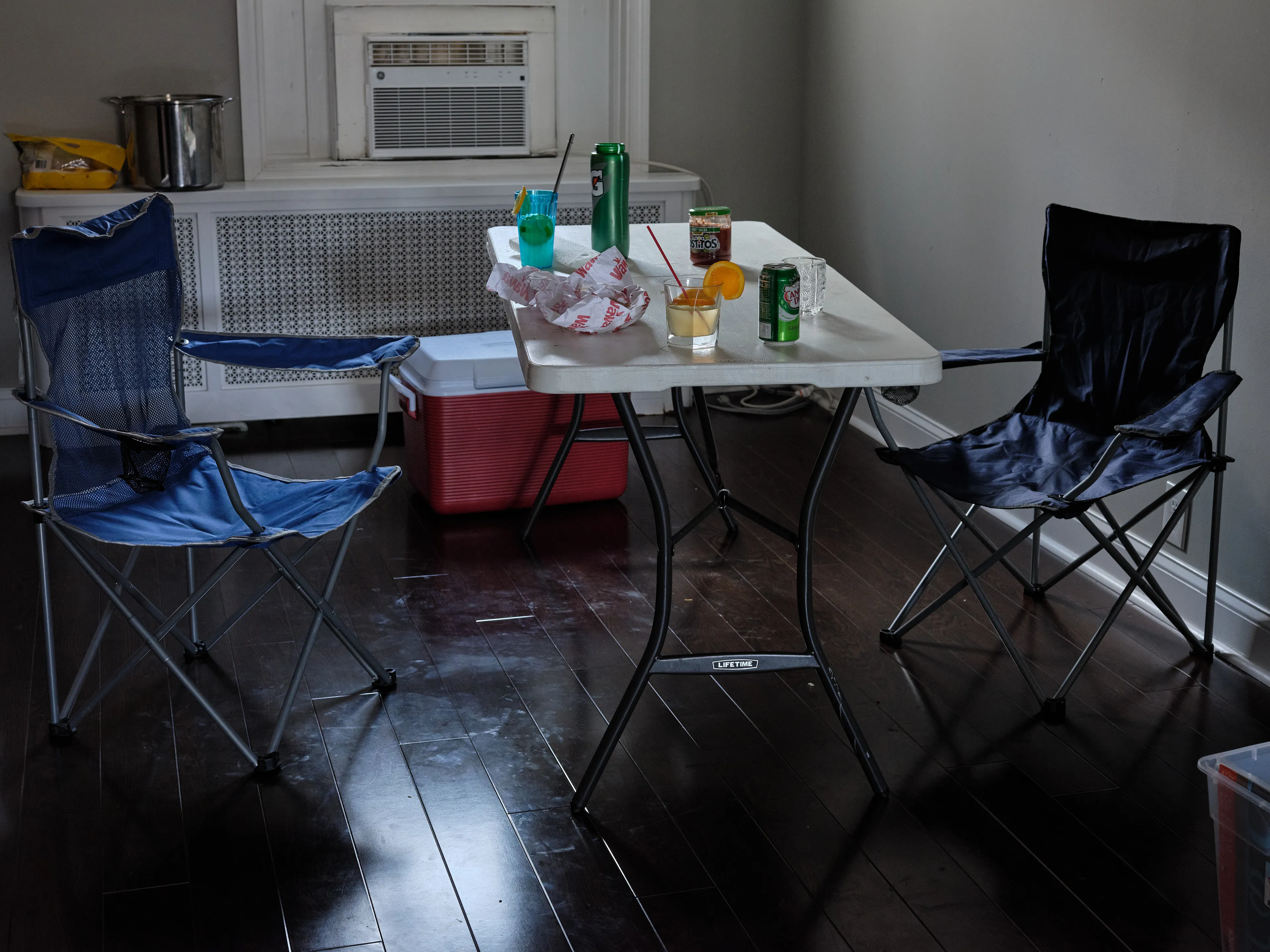 It's Expensive to be Poor #30 New Dinning Room by Hannah Price

I wanted to create a project on the costs of being poor. About how the U.S. system and bills keep the poor behind and dig a deeper hole in their life. In my research, I found a single mother of 32 years being neglected by affordable housing: Lisa McKine.

I first saw Lisa on a Philly Instagram page called nogunzone; it reposts police news and share reports from people in the community. I find it more informative than the local news, however I know several people who choose not to tune in for mental health reasons; it shows all the bad and we are currently on track to outdo last year’s homicide rate. 

Days after a tragic fire in another Philadelphia affordable housing apartment (PHA) that killed 12 people, a social media trend began with videos of people sharing themselves holding burning cigarettes near a silent smoke alarm. One in particular caught my eye, Lisa’s video of her son, telling him to wake up as a bunch of flies flew off his face.

Lisa did not grow up poor, she was raised by her dad and stepmother. Her dad worked for Philly managing janitorial duties in the courthouse. Her parents separated when she was young and it wasn’t until her 20’s when she learned bad habits from her biological mother of working the system. Lisa found herself a single mother of 2 and living in her first apartment of PHA affordable housing for ten years.

Lisa’s brother, Raul Gore (Bobby, 27) is currently on probation and has dealt with his own circumstances. He told me about the decisions he made in his early twenties that put him in and out of jail. He knows he can’t change how irresponsible he was but is now enjoying life with his family and providing for them. He works during the week and his wife on the weekends, they take turns watching their children. The environment Bobby grew up in at a younger age was surrounded by cops who watched him and his friends go to and from school. He remembers having fun with the cops by making them chase him and his friends. 

My first visit to Lisa’s place was at the beginning of March. There was an exterminator outside her building with hoses hooked up to an apartment on the second floor. Inside her apartment I noticed a particular odor and counted at least two roaches and one dead in the kitchen cabinet. Lisa had been complaining about the roach infestation to PHA since 2020, sharing records of failed exterminations and the summer of 2021 is when the flies started. The infestation has forced her to live out of bins and plastic bags. PHA exterminates the apartment every month and denies Lisa from moving to a new place. 

While photographing Lisa, I learned she has an associate in Applied Science in Construction Management from the college I work at. We crossed paths in 2018 but never met each other. Sharing personal frustrations, we spent a lot of time together as we both needed someone to just hear us and provide emotional support. Her boys Zaahir (11) and Quamir (5) are well behaved, social and sweet. Lisa provides for them all by driving Uber, bartering with her community, making and selling her own hair and skin products, as well as providing different hair services and body contouring.  

Luckily, Lisa found help to make a few months' deposit on rent for a new house outside of affordable housing. Through her 4 businesses, she plans to cover her rent of $2500. Lisa’s new house windows will help with her mood and knowing her dad is 13 minutes away in a nursing home should relieve some stress. Lisa’s dad had a stroke, causing bleeding in the brain which forced him to remove the left side of his brain. Her step mother also had brain surgery due to a horrible fall, and now both her parents are bed ridden while they recover from surgery.

Witnessing Lisa’s life, I imagined myself in her situation. A single mother unhappy in an infested home, barely getting by where the only way out is taking a huge risk renting a house not knowing she can afford it. The point of this NFT is to give back to the community, specifically Lisa so I have shared Lisa’s wallet address with you below.

The more time I spent with Lisa, the closer we became. We talked about dating and tried to provide emotional support for each other’s lives. I don’t become friends with all my subjects, but those who don’t have a problem expressing and sharing their feelings, I tend to share back. One day, I couldn’t help but break down crying and another day Lisa needed to as well. It was when we had planned to take the photograph in the window from the outside perspective that she was telling me how her dad was transferred to a different hospital. Wondering why, she demanded to see him and discovered he had a large infected bed sore that went up his back. From the photo, the scab looked at least 2’ long and 1’ wide with a fist sized faint sore. Why did they wait so long to tell Lisa? More neglect. Lisa would love to take care of him herself if she had known. In the end, Lisa still wanted to make the photograph, she wanted to keep her promise and help me with my project. I said no, but ultimately gave in even though it was completely dark out. My plan was to catch the sun setting. However, life isn’t what we plan it to be. During the photo, I could hear Lisa praying to God and her ancestors, full of sadness, hope and joy. 

To keep up with Lisa, follow her on Instagram @lovelylisa215, @hollywoodglamour.co, @mckine_building_group

Donate ether to Lisa’s address:  0x0cE11858dc7f01E6c2bEB9d1f2F6cb273484076e

Edition: 1 of 1

Commissioned by Obscura