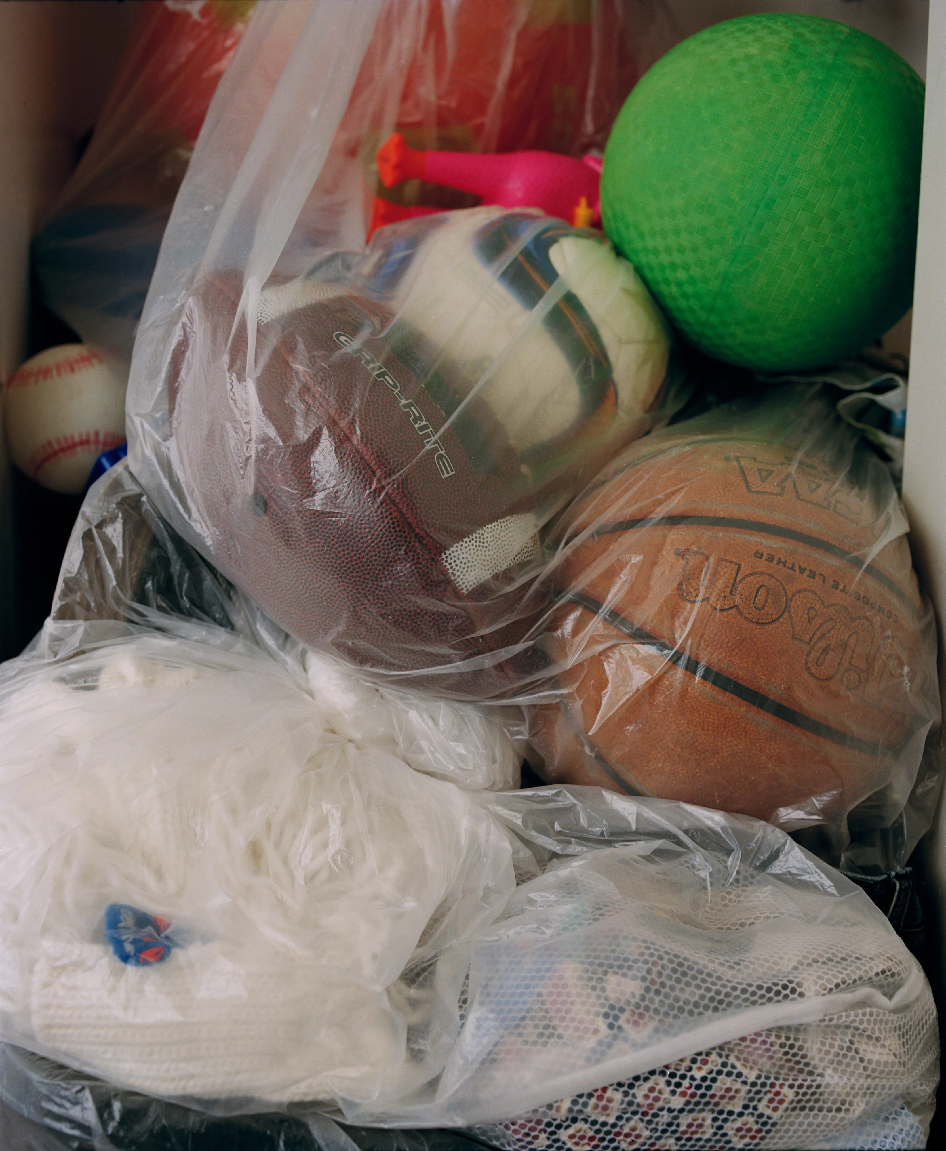 It's Expensive to be Poor #15 The Boy's Toy's by Hannah Price

I wanted to create a project on the costs of being poor. About how the U.S. system and bills keep the poor behind and dig a deeper hole in their life. In my research, I found a single mother of 32 years being neglected by affordable housing: Lisa McKine.

I first saw Lisa on a Philly Instagram page called nogunzone; it reposts police news and share reports from people in the community. I find it more informative than the local news, however I know several people who choose not to tune in for mental health reasons; it shows all the bad and we are currently on track to outdo last year’s homicide rate. 

Days after a tragic fire in another Philadelphia affordable housing apartment (PHA) that killed 12 people, a social media trend began with videos of people sharing themselves holding burning cigarettes near a silent smoke alarm. One in particular caught my eye, Lisa’s video of her son, telling him to wake up as a bunch of flies flew off his face.

Lisa did not grow up poor, she was raised by her dad and stepmother. Her dad worked for Philly managing janitorial duties in the courthouse. Her parents separated when she was young and it wasn’t until her 20’s when she learned bad habits from her biological mother of working the system. Lisa found herself a single mother of 2 and living in her first apartment of PHA affordable housing for ten years.

Lisa’s brother, Raul Gore (Bobby, 27) is currently on probation and has dealt with his own circumstances. He told me about the decisions he made in his early twenties that put him in and out of jail. He knows he can’t change how irresponsible he was but is now enjoying life with his family and providing for them. He works during the week and his wife on the weekends, they take turns watching their children. The environment Bobby grew up in at a younger age was surrounded by cops who watched him and his friends go to and from school. He remembers having fun with the cops by making them chase him and his friends. 

My first visit to Lisa’s place was at the beginning of March. There was an exterminator outside her building with hoses hooked up to an apartment on the second floor. Inside her apartment I noticed a particular odor and counted at least two roaches and one dead in the kitchen cabinet. Lisa had been complaining about the roach infestation to PHA since 2020, sharing records of failed exterminations and the summer of 2021 is when the flies started. The infestation has forced her to live out of bins and plastic bags. PHA exterminates the apartment every month and denies Lisa from moving to a new place. 

While photographing Lisa, I learned she has an associate in Applied Science in Construction Management from the college I work at. We crossed paths in 2018 but never met each other. Sharing personal frustrations, we spent a lot of time together as we both needed someone to just hear us and provide emotional support. Her boys Zaahir (11) and Quamir (5) are well behaved, social and sweet. Lisa provides for them all by driving Uber, bartering with her community, making and selling her own hair and skin products, as well as providing different hair services and body contouring.  

Luckily, Lisa found help to make a few months' deposit on rent for a new house outside of affordable housing. Through her 4 businesses, she plans to cover her rent of $2500. Lisa’s new house windows will help with her mood and knowing her dad is 13 minutes away in a nursing home should relieve some stress. Lisa’s dad had a stroke, causing bleeding in the brain which forced him to remove the left side of his brain. Her step mother also had brain surgery due to a horrible fall, and now both her parents are bed ridden while they recover from surgery.

Witnessing Lisa’s life, I imagined myself in her situation. A single mother unhappy in an infested home, barely getting by where the only way out is taking a huge risk renting a house not knowing she can afford it. The point of this NFT is to give back to the community, specifically Lisa so I have shared Lisa’s wallet address with you below.

The more time I spent with Lisa, the closer we became. We talked about dating and tried to provide emotional support for each other’s lives. I don’t become friends with all my subjects, but those who don’t have a problem expressing and sharing their feelings, I tend to share back. One day, I couldn’t help but break down crying and another day Lisa needed to as well. It was when we had planned to take the photograph in the window from the outside perspective that she was telling me how her dad was transferred to a different hospital. Wondering why, she demanded to see him and discovered he had a large infected bed sore that went up his back. From the photo, the scab looked at least 2’ long and 1’ wide with a fist sized faint sore. Why did they wait so long to tell Lisa? More neglect. Lisa would love to take care of him herself if she had known. In the end, Lisa still wanted to make the photograph, she wanted to keep her promise and help me with my project. I said no, but ultimately gave in even though it was completely dark out. My plan was to catch the sun setting. However, life isn’t what we plan it to be. During the photo, I could hear Lisa praying to God and her ancestors, full of sadness, hope and joy. 

To keep up with Lisa, follow her on Instagram @lovelylisa215, @hollywoodglamour.co, @mckine_building_group

Donate ether to Lisa’s address:  0x0cE11858dc7f01E6c2bEB9d1f2F6cb273484076e

Edition: 1 of 1

Commissioned by Obscura