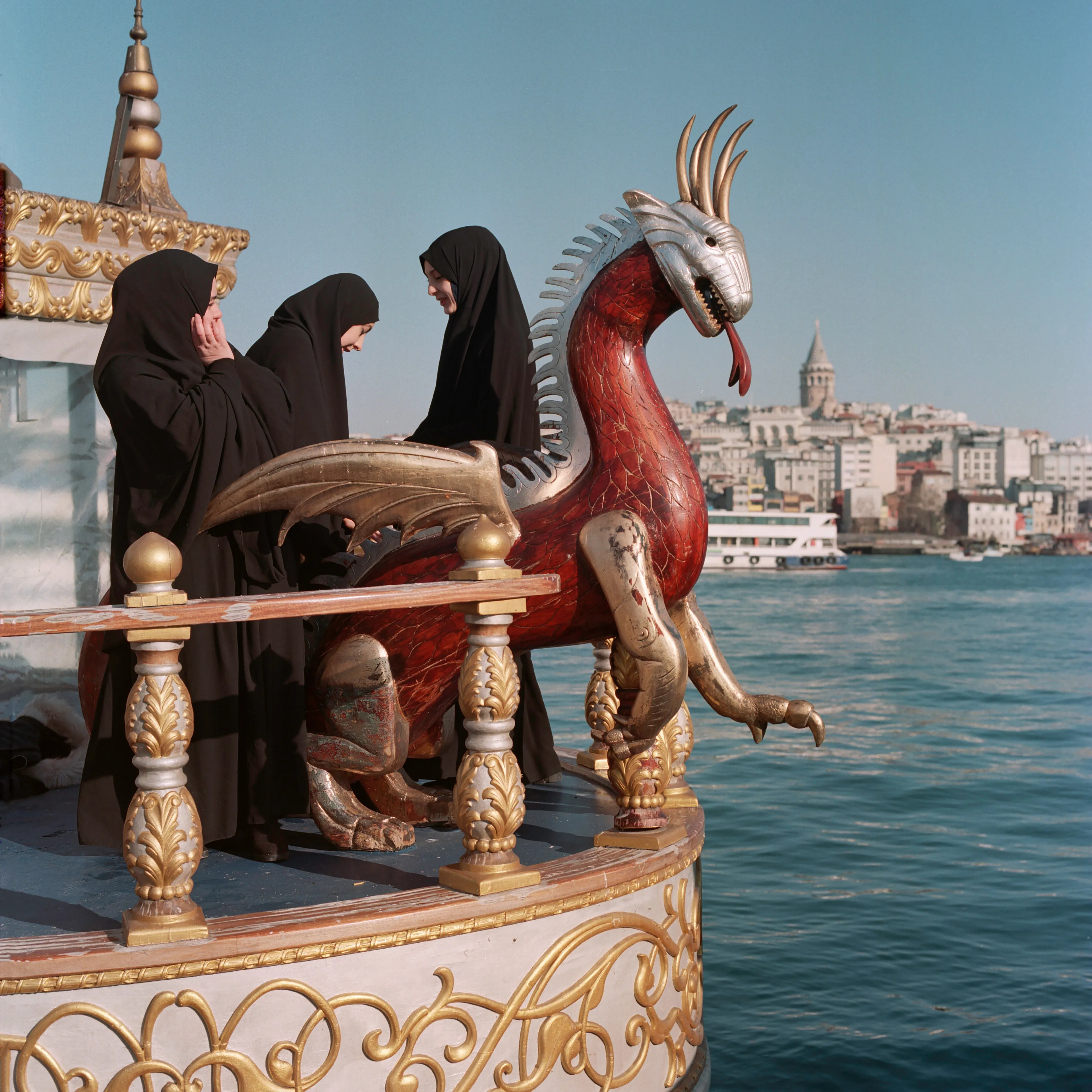 Transfiguration #16 by Sabiha Çimen

Şeyma on the dragon boat with her friends. Istanbul, Turkey.

The impetus of this project grew out of my first book Hafız, about young girls who are memorizing Quran in schools through-out Turkey. Some marry and have children soon after graduation, but some rebel and transform themselves in a radical way; Şeyma is one of those stories of Transfiguration.

This is a world known to me because I too studied in a Quran school with my twin sister in Istanbul when I was younger.  When I returned to do my first long term photographic project l sought out familiar scenes and objects from my memory there and it was there that I met Şeyma and her unique and radical ways.

My projects usually deal with the Art of Resistance within my close circle of friends and family. In my last project the young girls' trivialities and playfulness took center stage, and now as these girls enter into adulthood they are faced with living in a world of male dominance. Sometimes, as with Şeyma, there is a need for revenge with their new found power over men and their money and habits; an inner strength coming from raw female intellect, and sexuality. 

This time my project not only focuses on the girls stories, but lies within the context of a large city- Istanbul, with its multiple layers and meanings. l am trying to provide the viewer cause and effect by viewing the different strata simultaneously and between. In the story Şeyma l am portraying her world, her fantasies, her fears, hidden love stories, songs and signs, ancient traditions, religious black-outs, and her continued spirituality that was never lost even through her Transfiguration. 


Edition: 1 of 1

Commissioned by Obscura