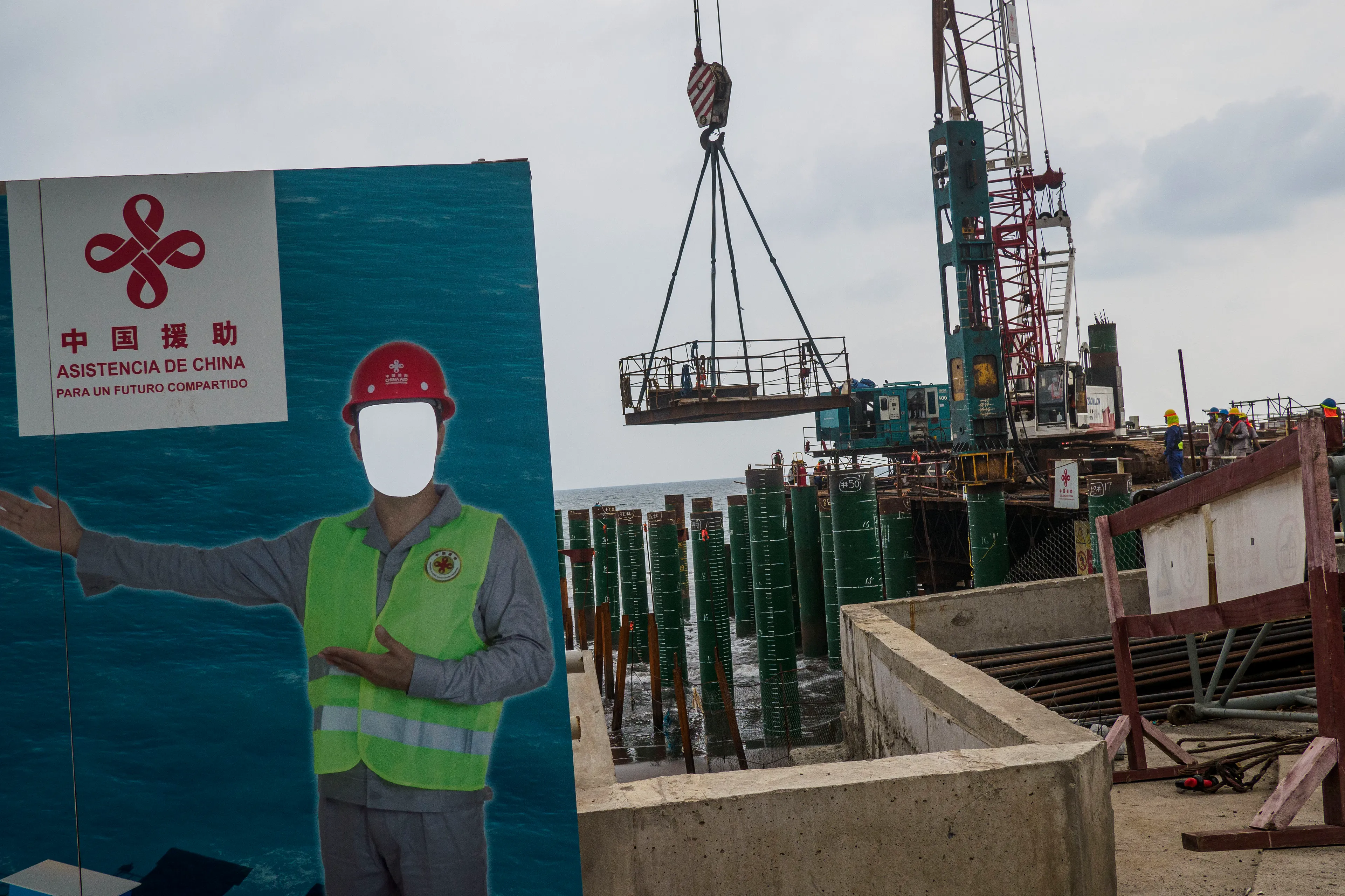 « Bitcoin Nation » #15 by Thomas Dworzak

EL SALVADOR, San Salvador, 2022/3-4. Chinese sponsored building site in the port. Accepting Chinese investment has been a point of friction between the US and EL SALVADOR.

« Bitcoin Nation » - El Salvador - Thomas Dworzak / Magnum Photos

Many photographers and journalists of my generation, interested in war and conflict, would at one point read Richard Kapusciznsky's all-time classic "The Soccer War" and watch Oliver Stone's "Salvador. » The latternow feels insanely cheesy. With the country's troubled history in mind and never having been to Central America, I found "Bitcoin Nation - El Salvador" a challenging theme to explore for this NFT project. 

I set out to straightforwardly document this alien and invisible world of bitcoin, and being 'in the realm of crypto,' I hoped it would give me access to President Nayib Bukele's surprise project. Last year he had suddenly declared Bitcoin the official currency of El Salvador - which until now was only the US dollar. The 40-year-old president of Palestinian origin started out as an anti-establishment candidate, describing himself as "the world's coolest dictator," but soon took an authoritarian turn. Yet he continues drumming the bitcoin beat, and bitcoin celebrities from all around the world keep flocking to El Salvador.
The Pacific beach town of El Zonte became "Bitcoin Beach," and "Volcano Bonds" and "Bitcoin City" are meant to be the future.

When official doors remained closed for me, I started digging for clues in the county's troubled past and present or anything, even remotely, related to the bitcoin world. Vignettes of the bloody civil war regularly popped up, and I came across a few "bitcoin events." The sudden spike of almost a hundred homicides in the course of one weekend in late March, due to what seemed a breakdown of a secret deal between the government and the two main gangs, had President Bukele declare a state of emergency, martial law and intensify the war on the gangs. I could see fringes of it. But nothing compared to the brutality of
the spectacularly filmed daily government propaganda videos of mass arrests and more-than-rough prisoner handlings I watched on TV, Twitter, and Instagram.

It was at a small bitcoin event that I found a hint why I may have been shunned and didn't get any access to show the "shiny world of Bitcoin Nation," as I had hoped. My NFT ticket was definitely the "wrong church" in the Bitcoin world. To paraphrase one of the speakers: "If I want to gamble, I go to Vegas and party with beautiful hookers, instead of being a loser, sitting around in my basement, frustrated, minting NFTs. Shitcoins."

El Salvador and the President were meant to be guests of honor at the Bitcoin 2022 conference in Miami. But due to the internal tension, he canceled the visit, and the 30+ thousand delegates had to discuss the future of bitcoin without him.

Edition: 1 of 1

Commissioned by Obscura